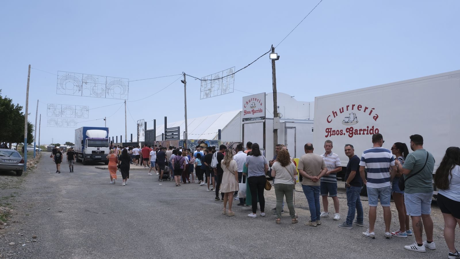 Imágenes de la degustación de huevos fritos con chorizo, en las Fiestas de Santa María del Águila