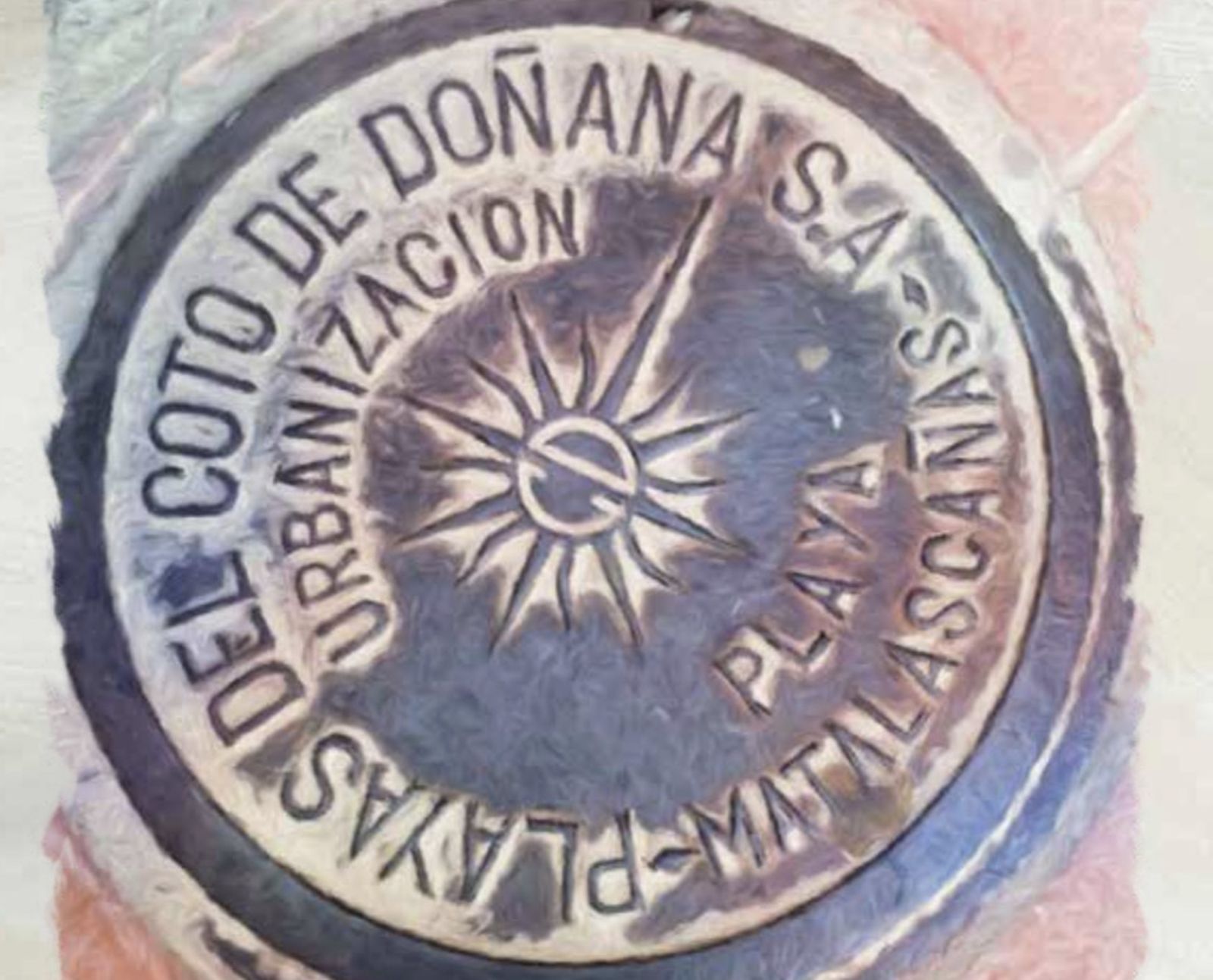 Tapa de alcantarilla con la denominación social de la primera constructora de la urbanización.