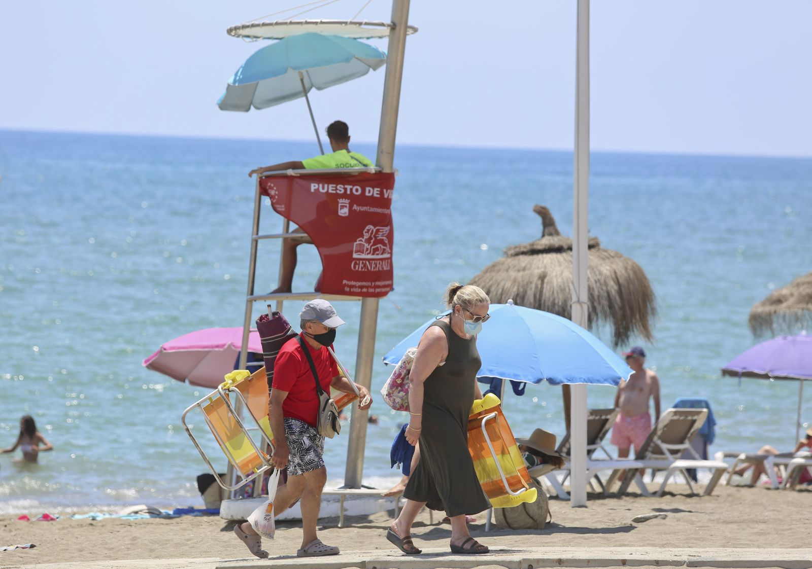 Fotos del primer día de mascarillas obligatorias en las playas y el Centro de Málaga