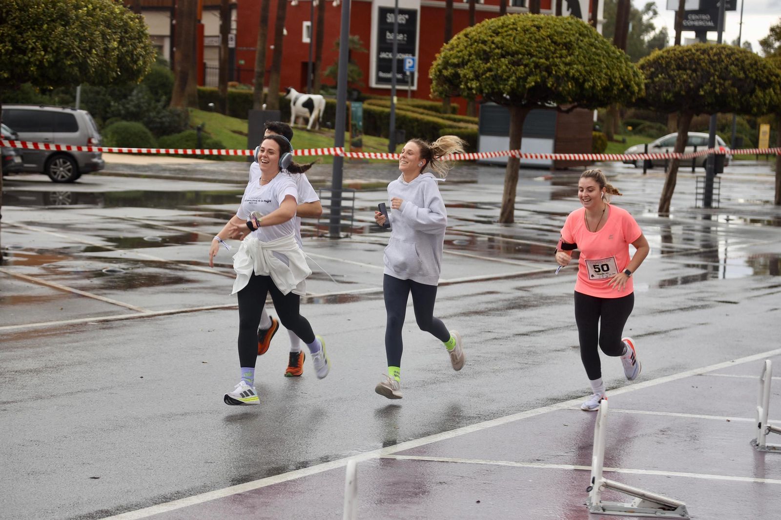 La Carrera por el Día Internacional de la Mujer en Málaga, en fotos