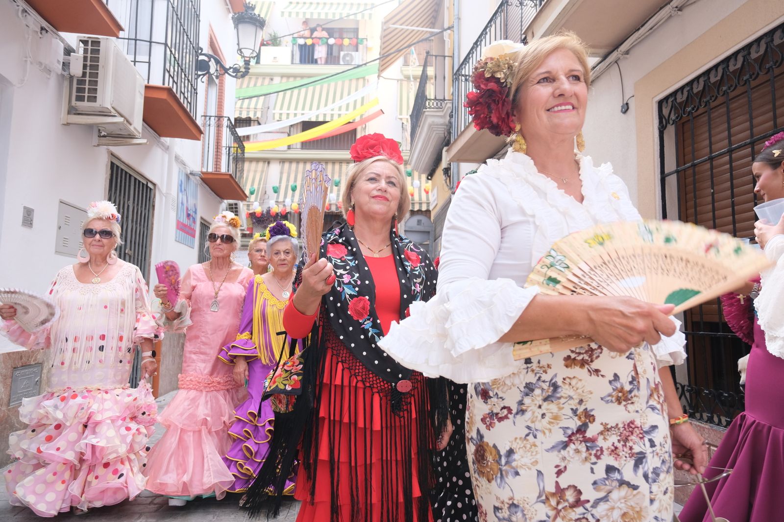 La celebración en Cabra del Día de la Mujer con motivo de la Real Feria, en imágenes