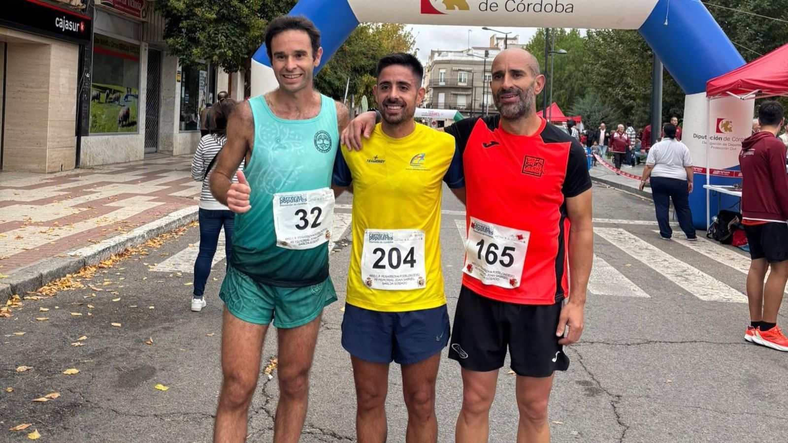 El podio masculino en la Carrera Popular de Peñarroya-Pueblonuevo.