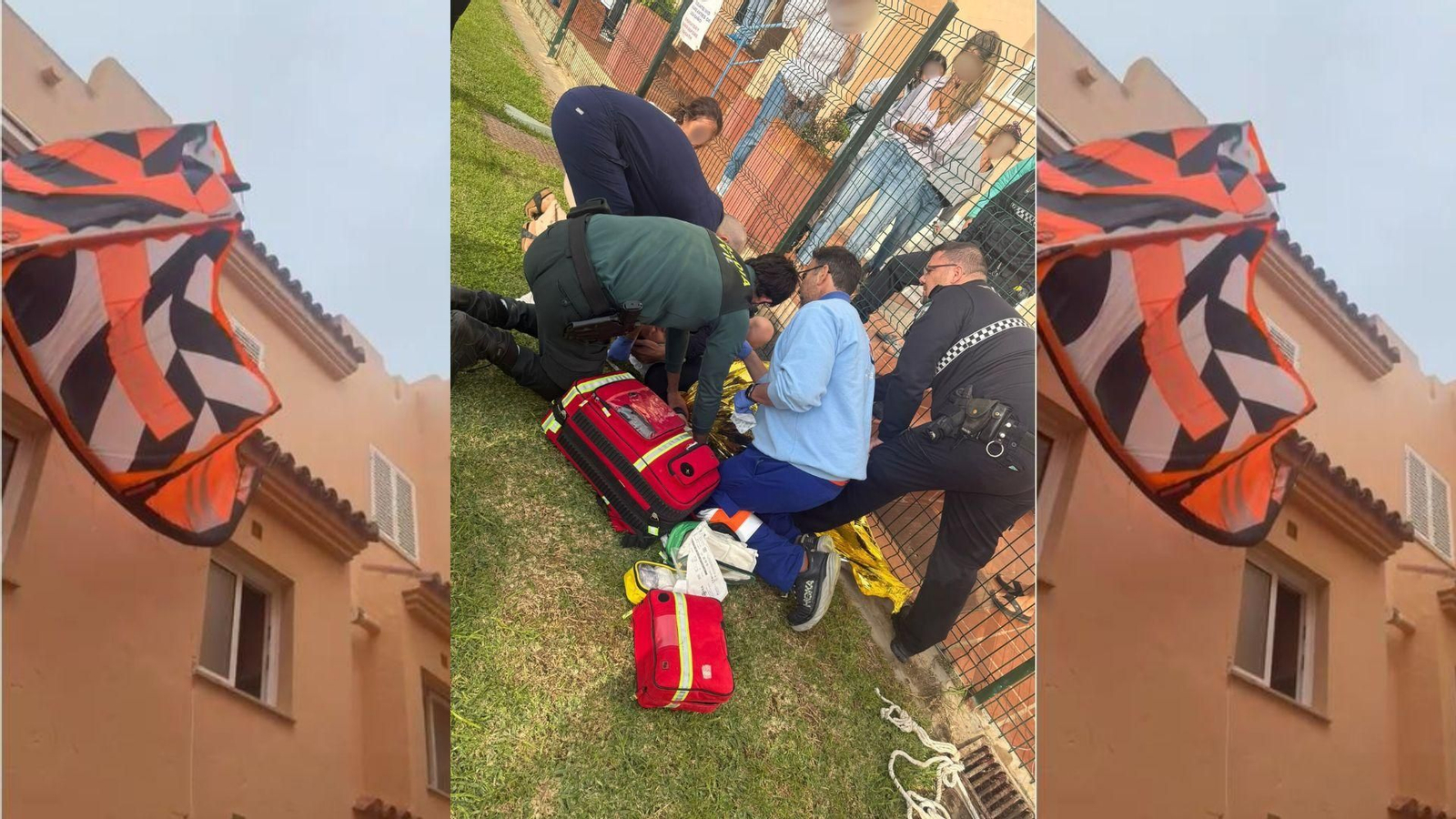 El kitesurfista, atendido tras el accidente en Los Lances, y la cometa enganchada en una vivienda.