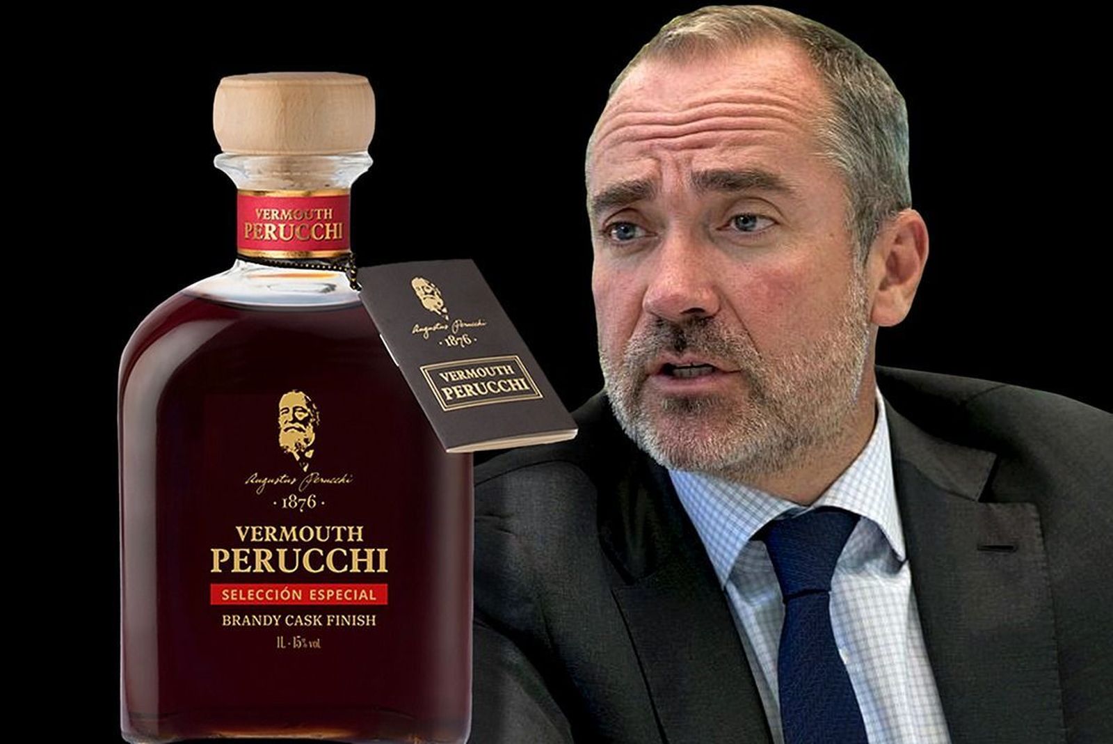 Jean-Noël Reynaud y una botella de Perucchi.