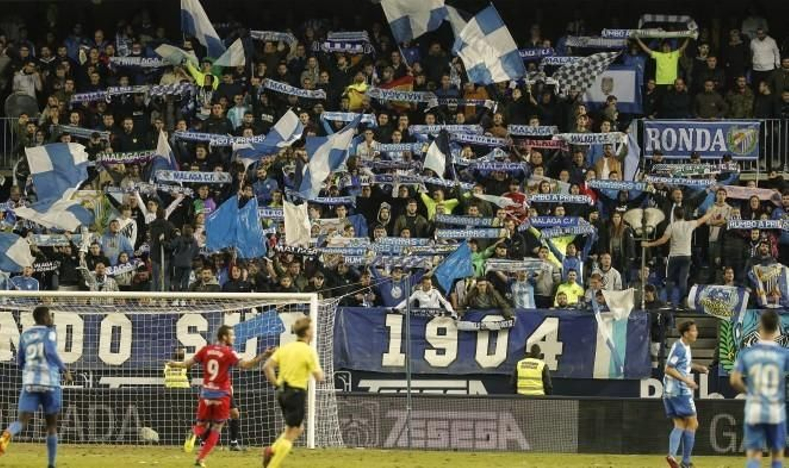 La afición del Málaga anima durante un partido.