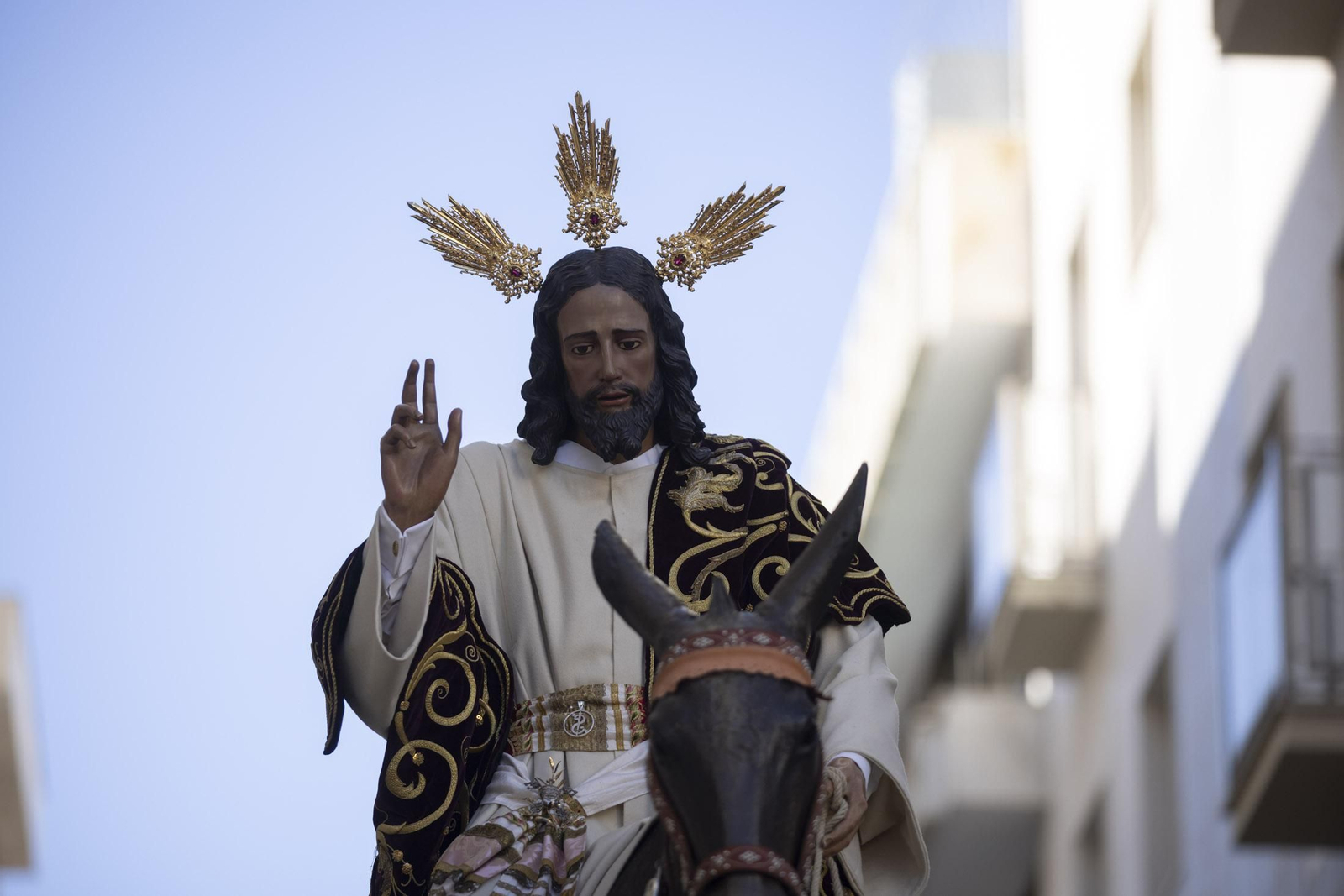 Imágenes de la salida extraordinaria de La Borriquita por las calles de Huelva