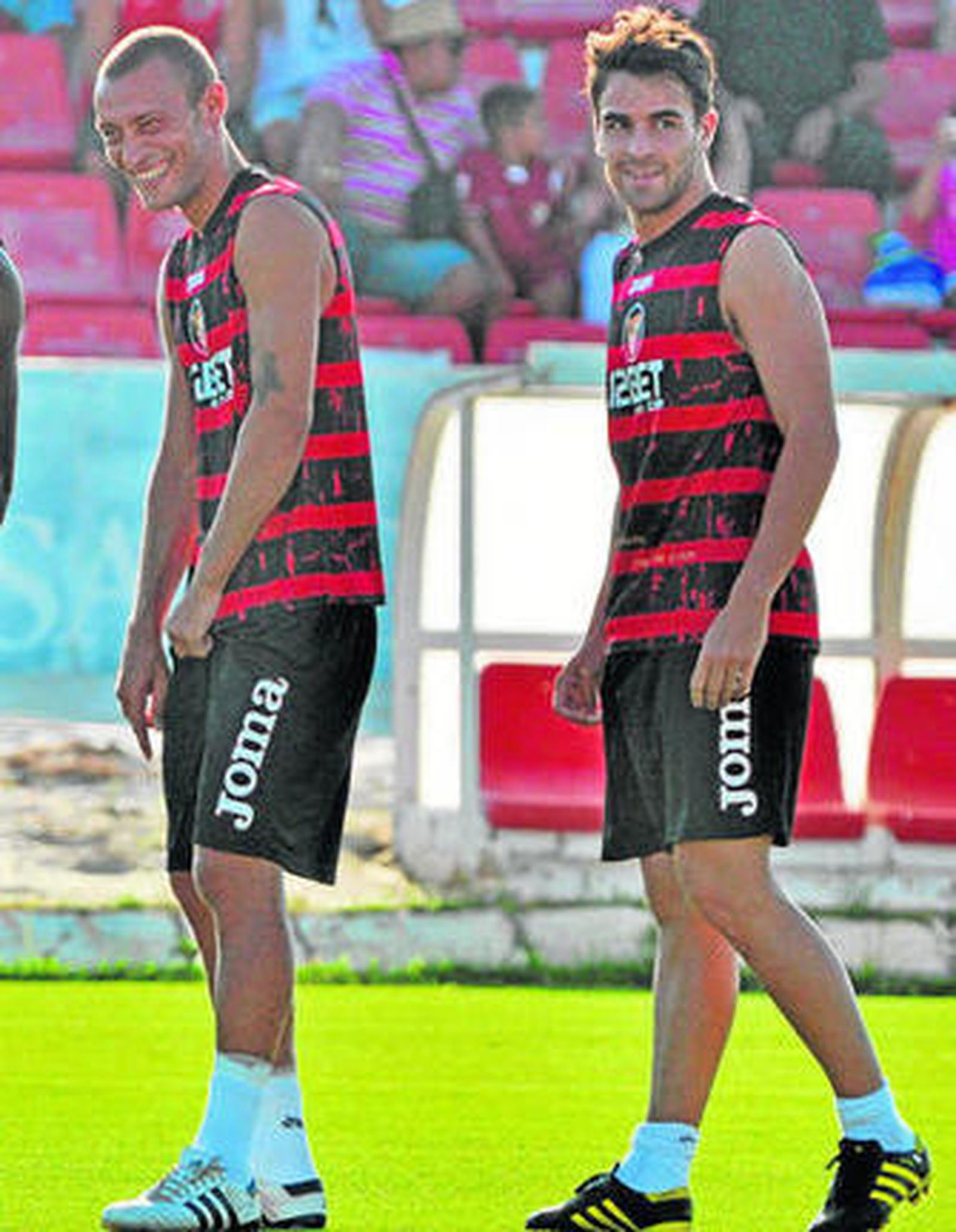 Guarente y Cigarini, juntos en la ciudad deportiva.