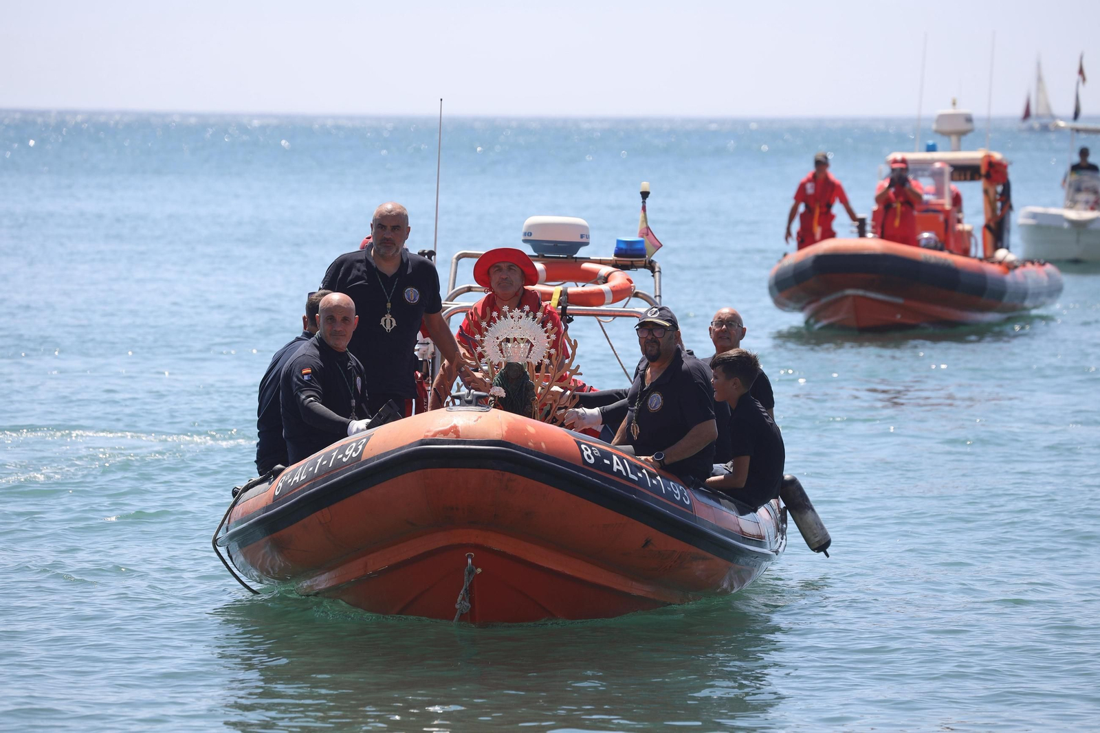 La procesión en Málaga de la Virgen del Carmen de los submarinistas, en imágenes