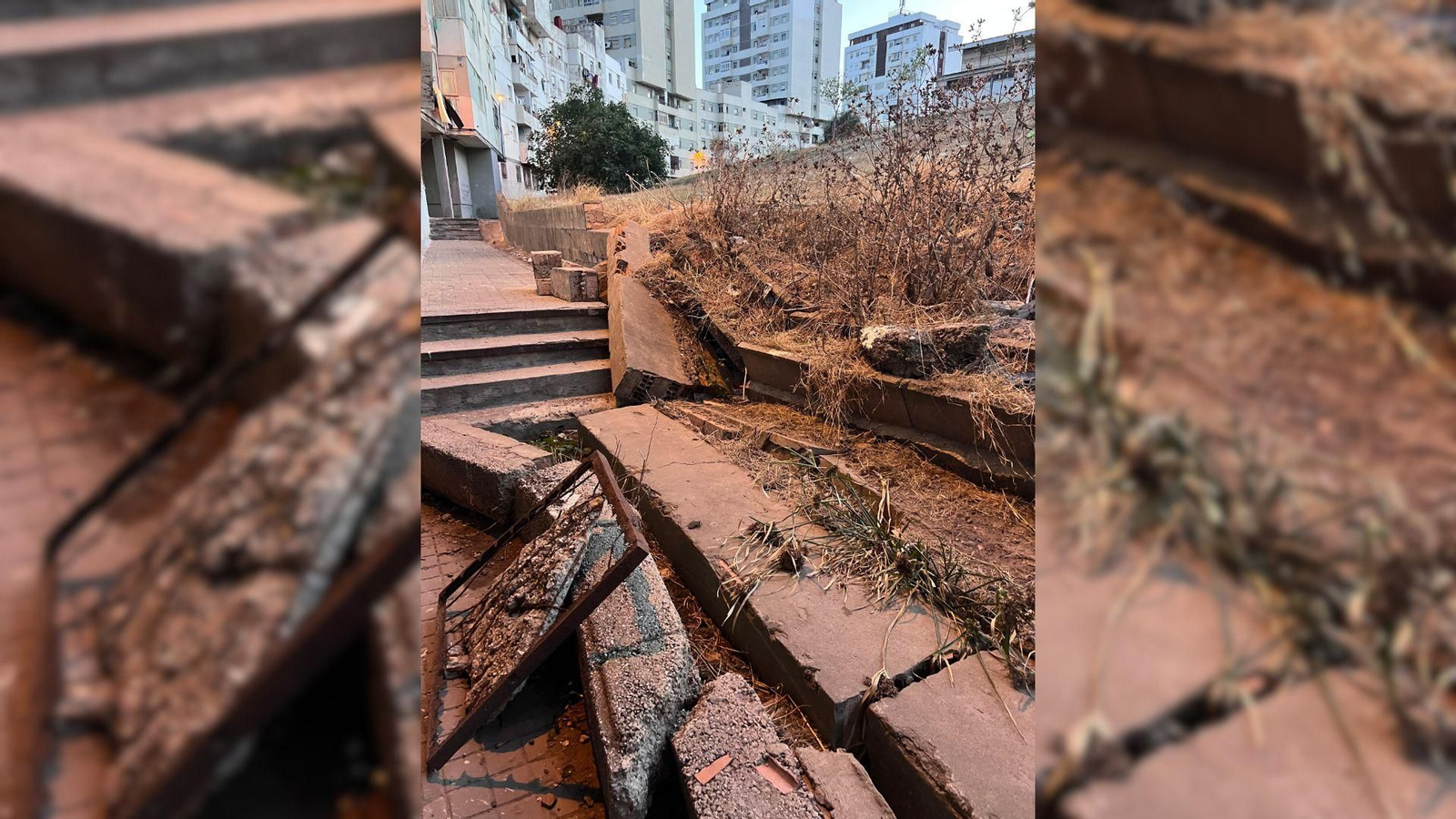 Traseras del colegio Tartessos, que desemboca en un descampado lleno de matorrales, con una escalera medio derruida y canalizaciones atascadas.