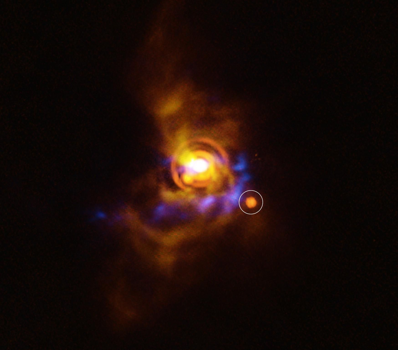 Una posible compañera orbitando alrededor de la joven estrella V960 Mon, situada a más de 5.000 años luz de distancia.
