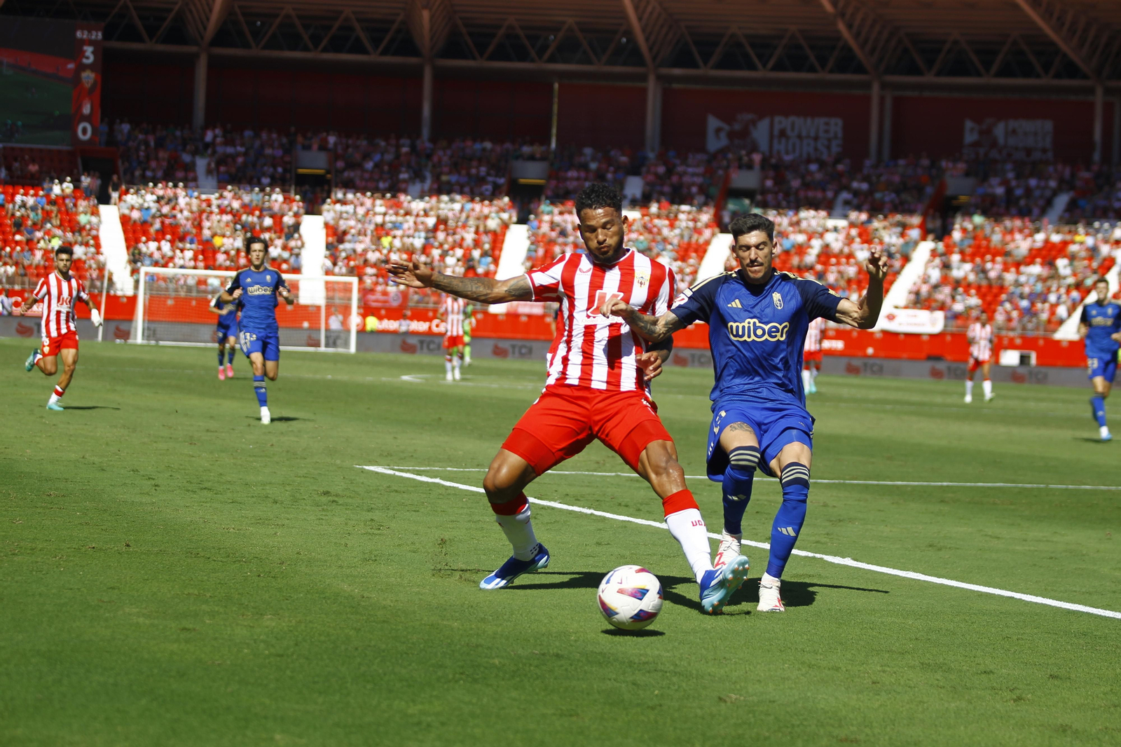 Imágenes del empate a 3 de la U.D. Almería y el Granada C.F.