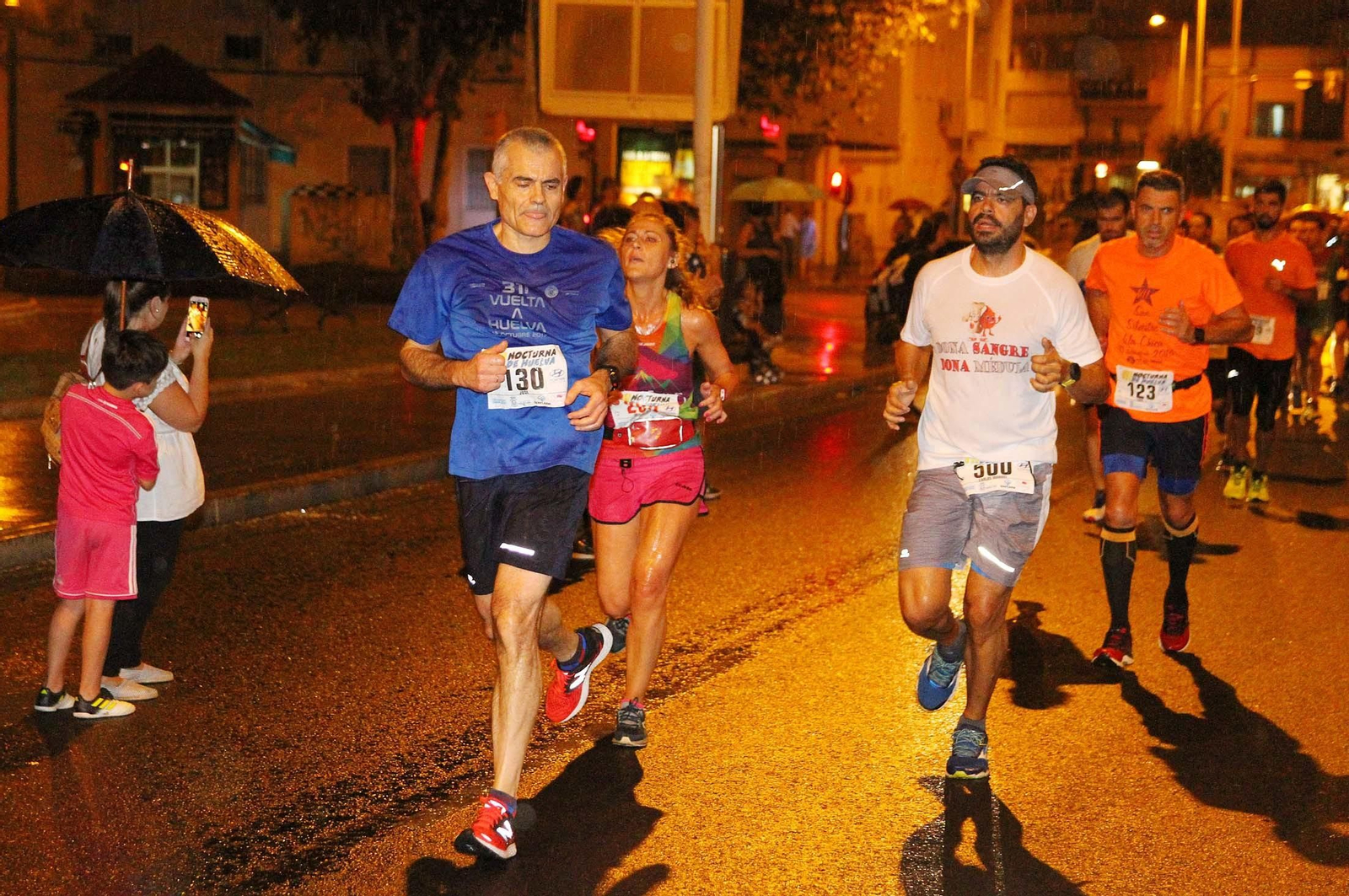 La VII Carrera Nocturna de Huelva en imágenes