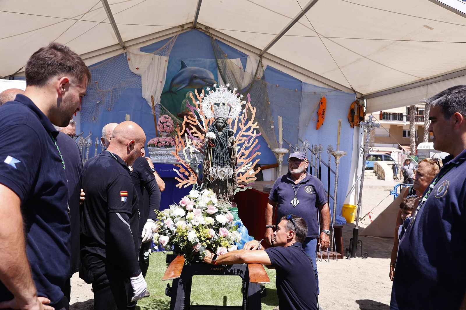 La procesión en Málaga de la Virgen del Carmen de los submarinistas, en imágenes