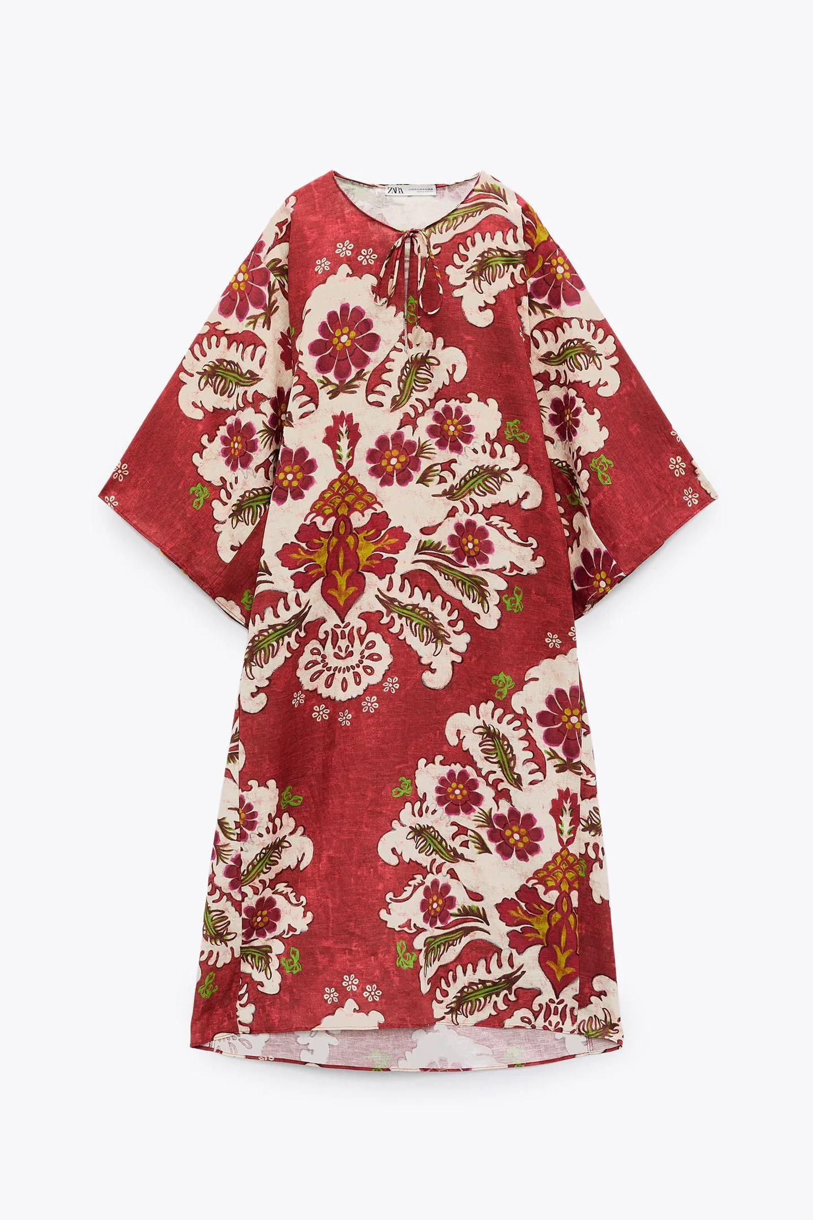 Vestido tipo túnica de lino con estampado de flores de Zara.