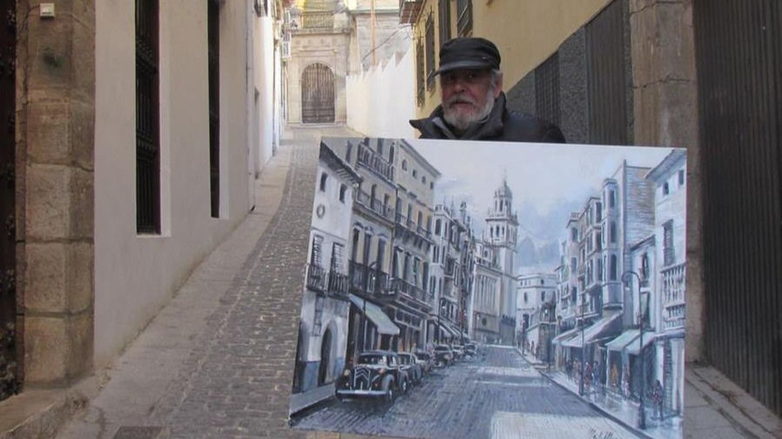 El pintor Melchor Mesa, con uno de los innumerables cuadros que pintó de la Catedral de Jaén.