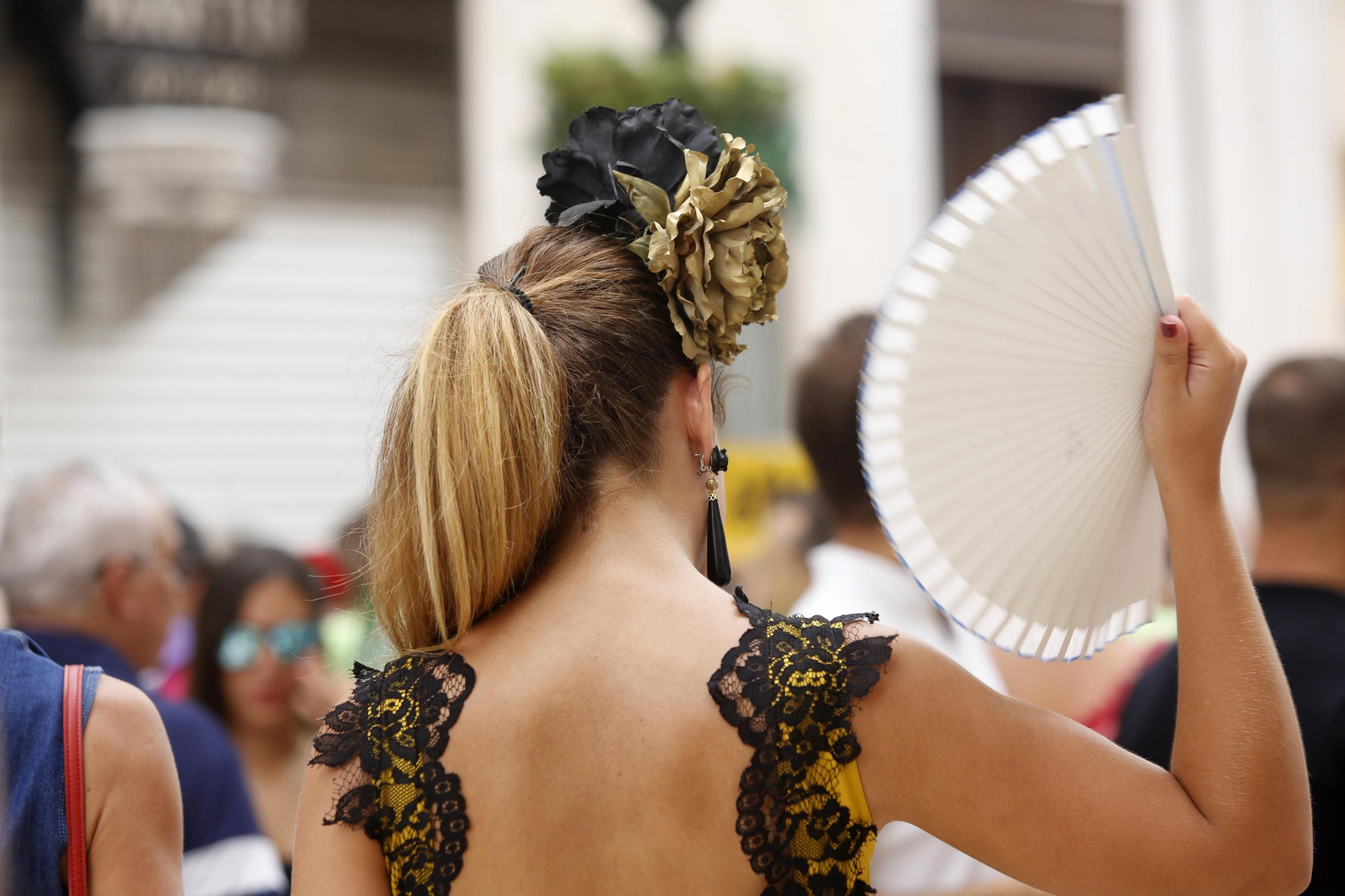 Una mujer con un abanico durante la pasada Feria de Málaga.