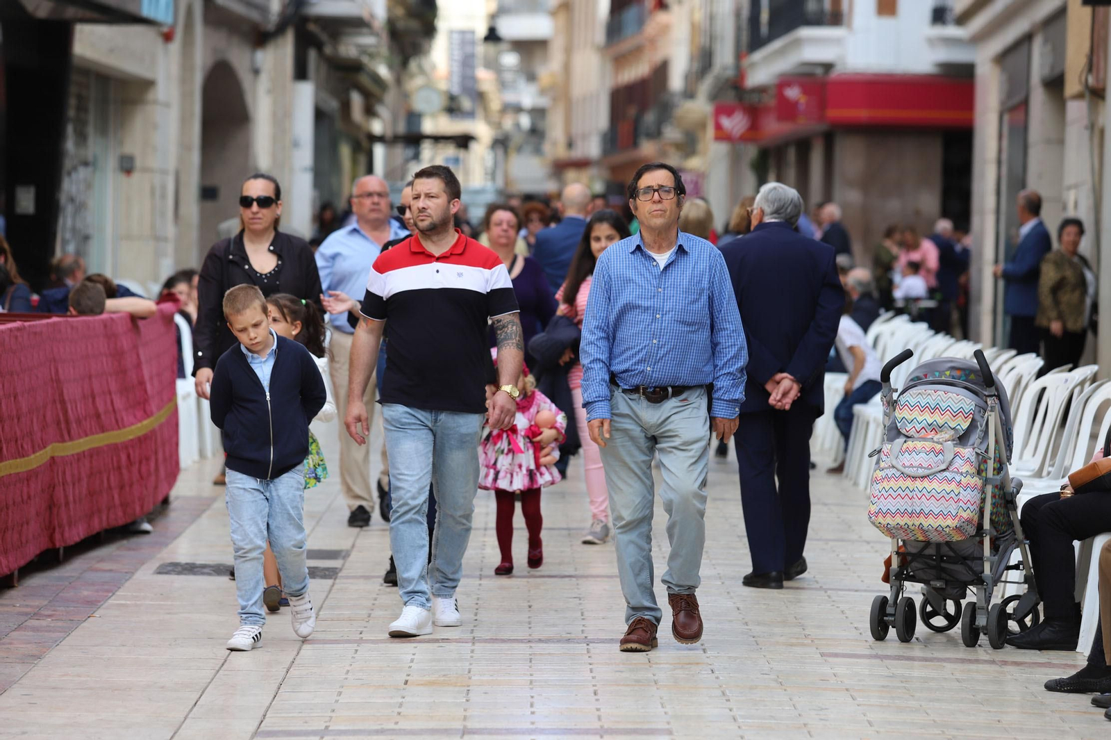 Imágenes del recorrido de la Borriquita  por las calles de Huelva