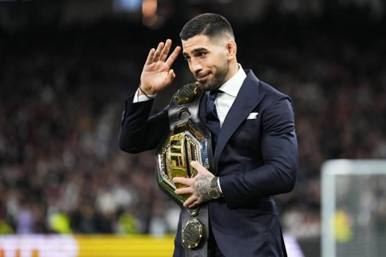 MADRID, SPAIN - FEBRUARY 25: Ilia Topuria, UFC Featherweight Champion, is seen with his belt on the pitch prior to the LaLiga EA Sports match between Real Madrid CF and Sevilla FC at Estadio Santiago Bernabeu on February 25, 2024 in Madrid, Spain. (Photo by Angel Martinez/Getty Images) MADRID, SPAIN - FEBRUARY 25: Ilia Topuria, UFC Featherweight Champion, is seen with his belt on the pitch prior to the LaLiga EA Sports match between Real Madrid CF and Sevilla FC at Estadio Santiago Bernabeu on February 25, 2024 in Madrid, Spain. (Photo by Angel Martinez/Getty Images)
