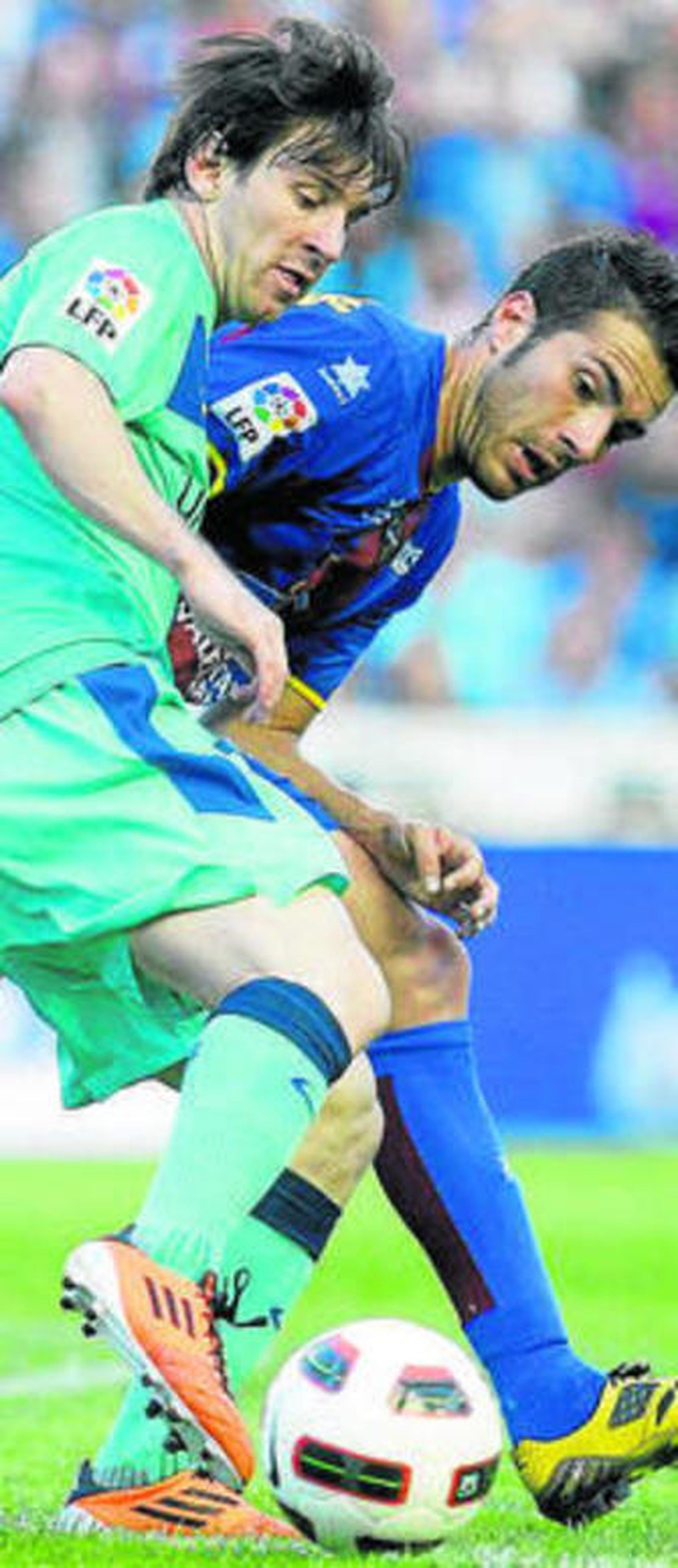 Messi y Xavi Torres.