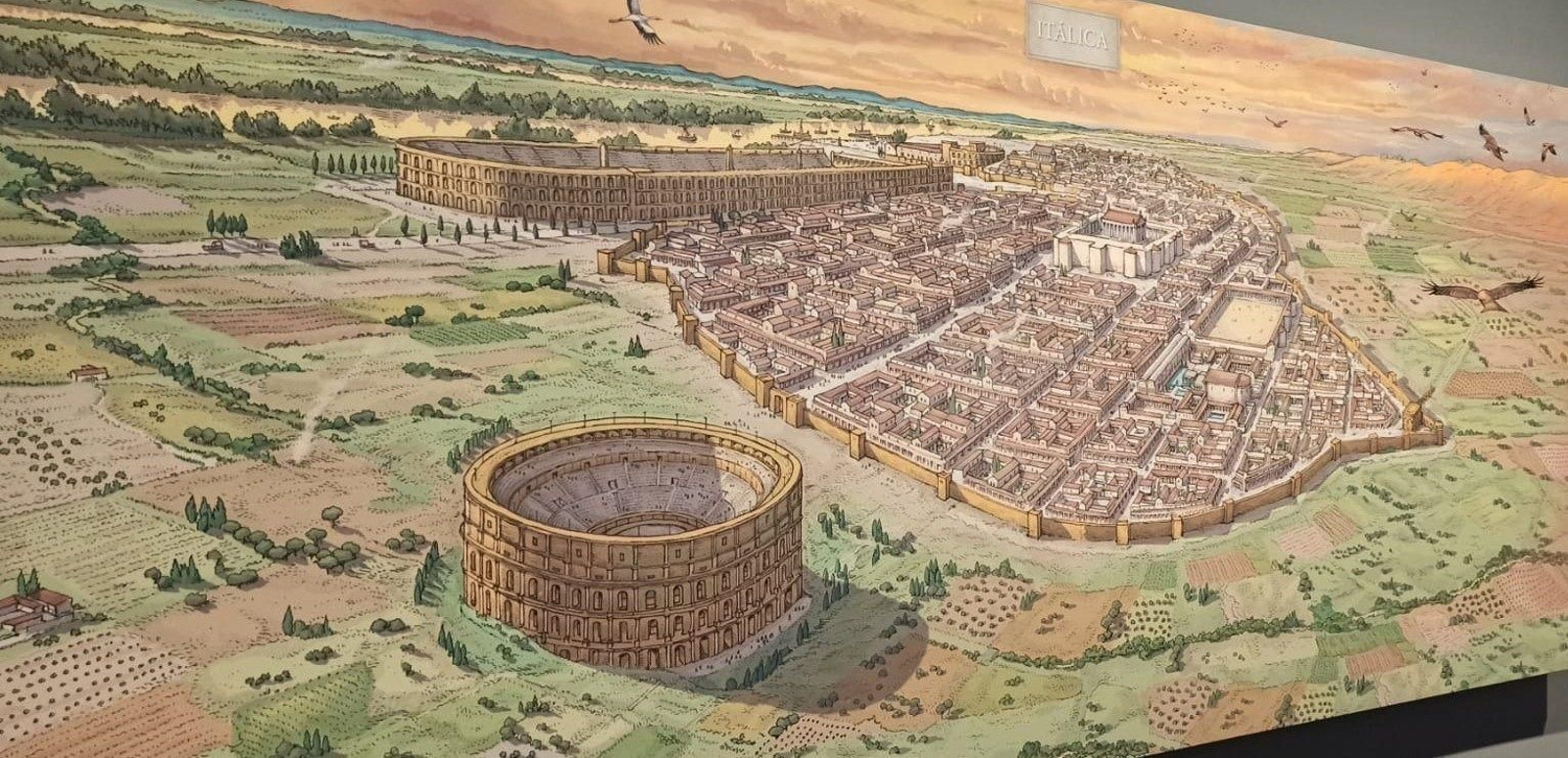 Imagen de una recreación artística de Itálica con su recién detectado circo al fondo.