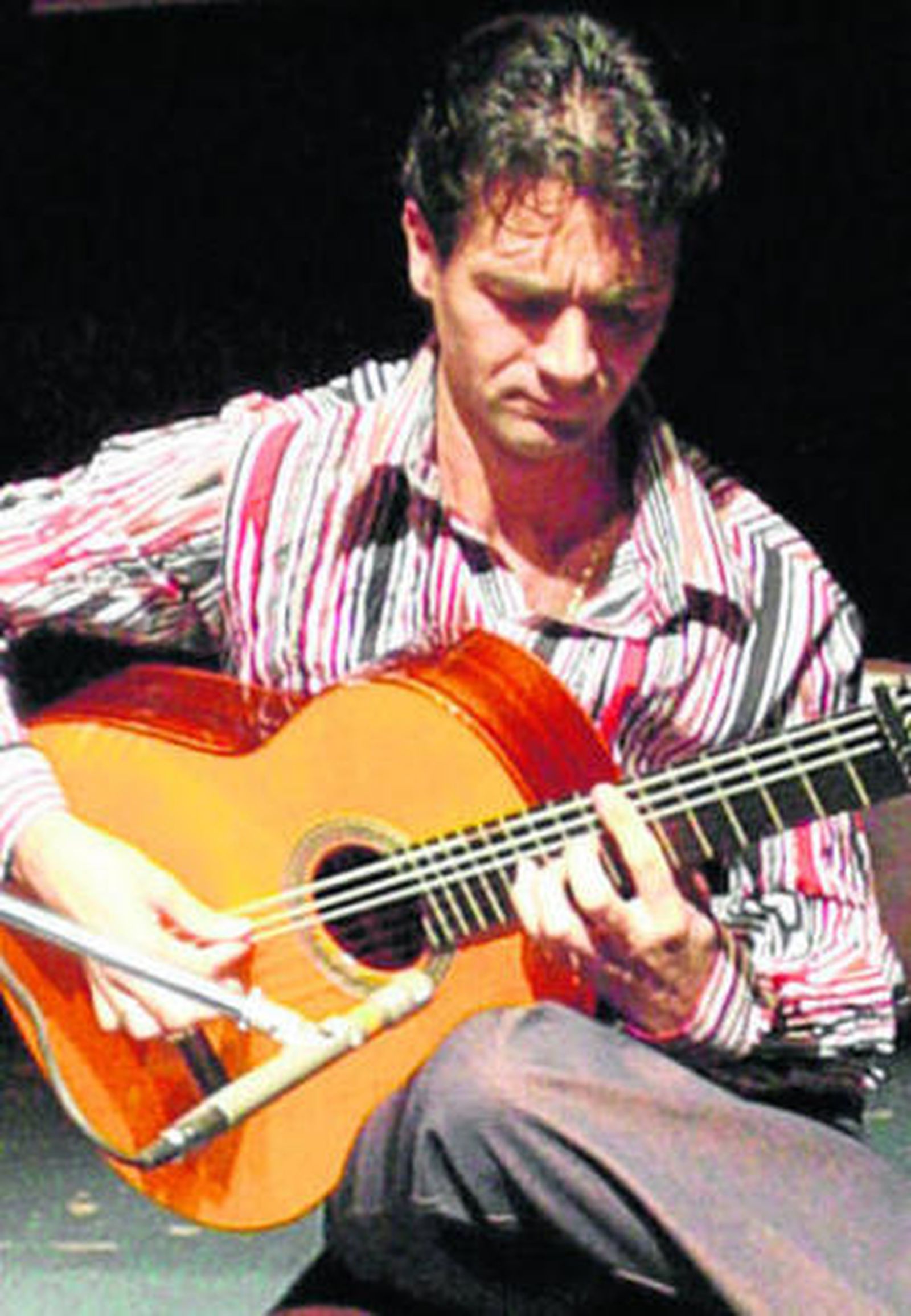Niño de Pura, con su guitarra.