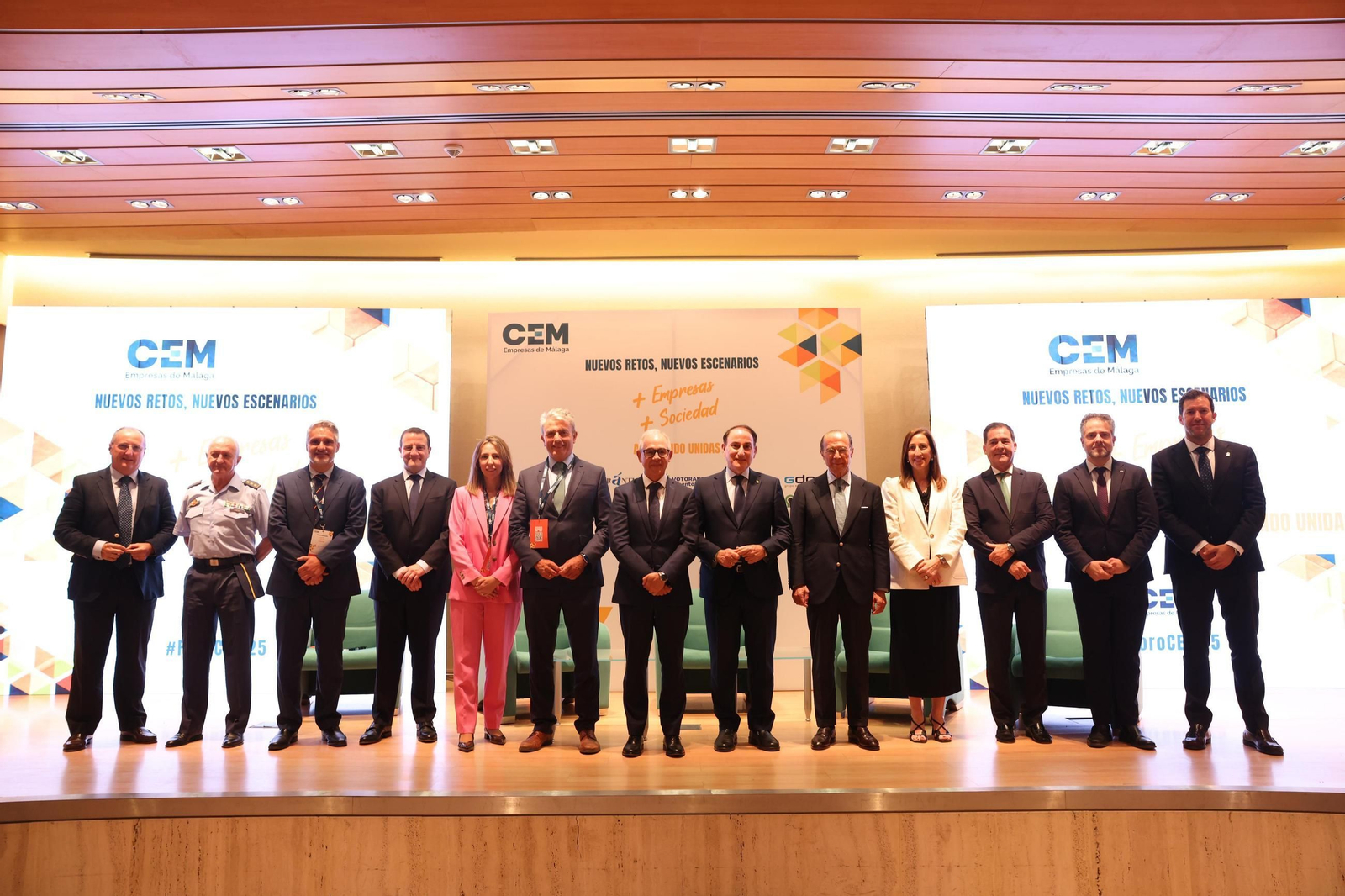 Foto de familia de empresarios y representantes de Unicaja, este martes en Málaga.