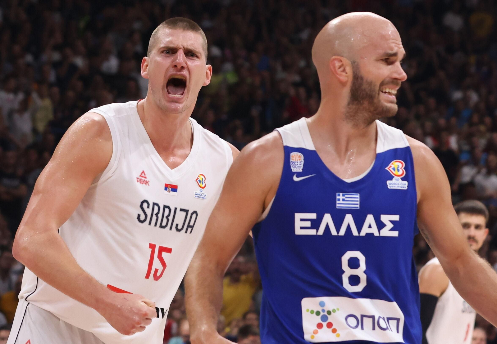 Nikola Jokic y Nick Calathes.