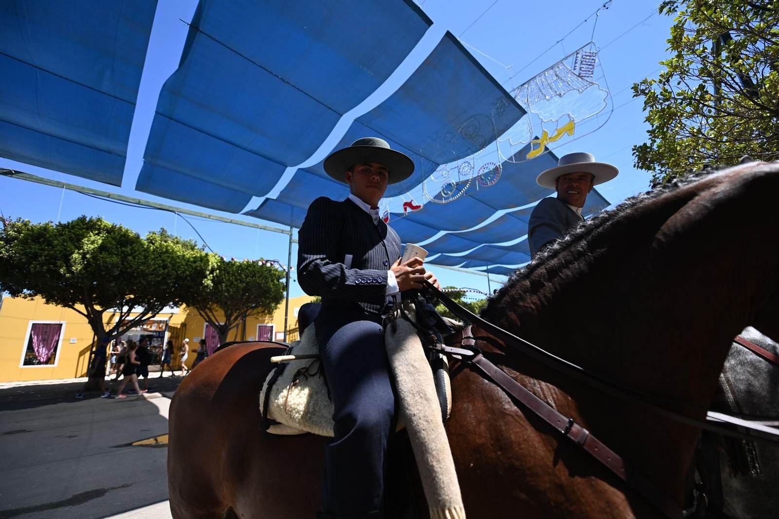 Las fotos del lunes festivo en la Feria en Málaga