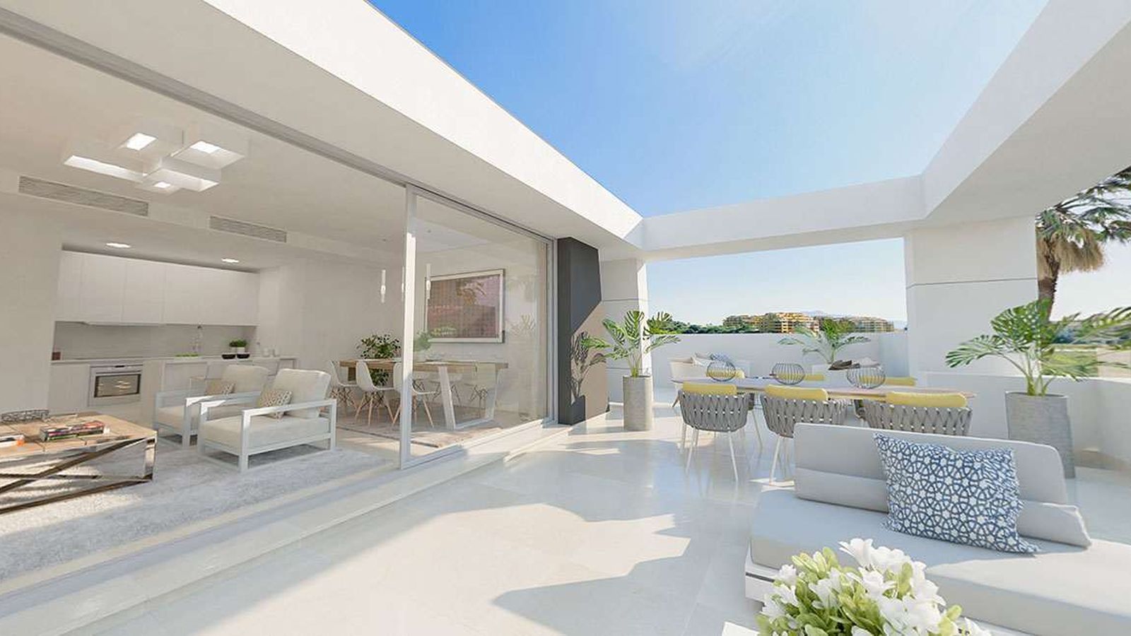 Cocina abierta al salon con la terraza en Vanian Gardens en Estepona.