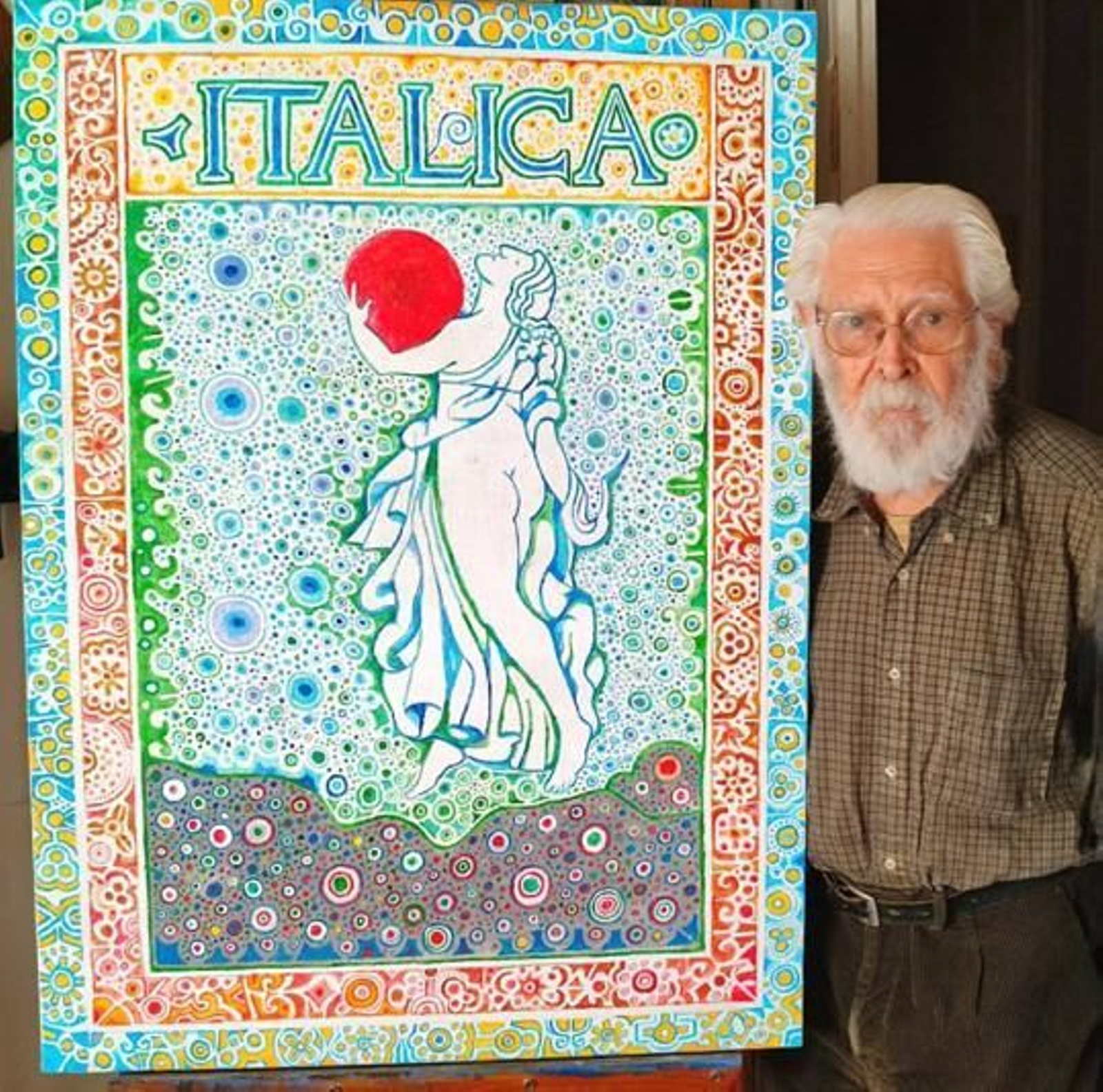 El pintor sevillano Juan Romero junto al cartel del Festival Internacional de Danza de Itálica