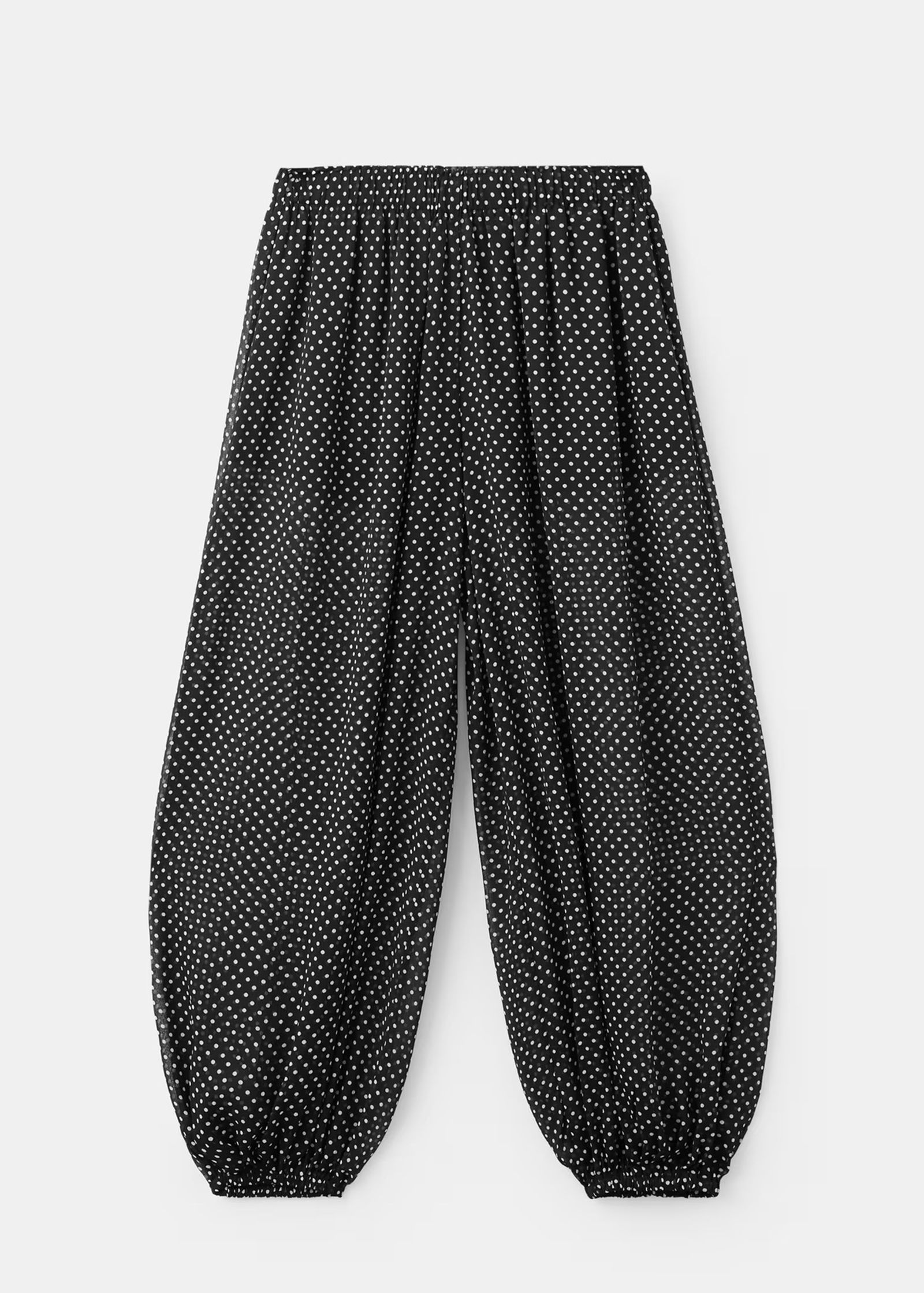 Pantalones bombachos de lunares de Mango.