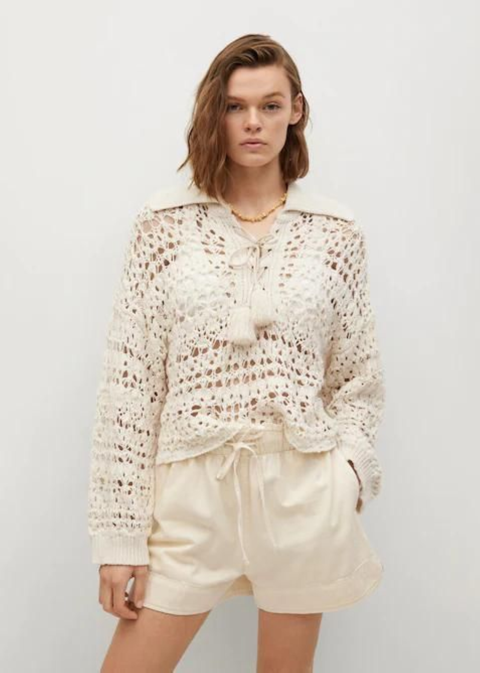 El jersey de punto calado de Mango.