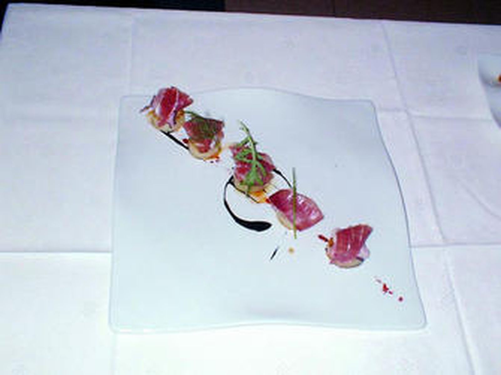 Confit de patatas con pulpo de roca