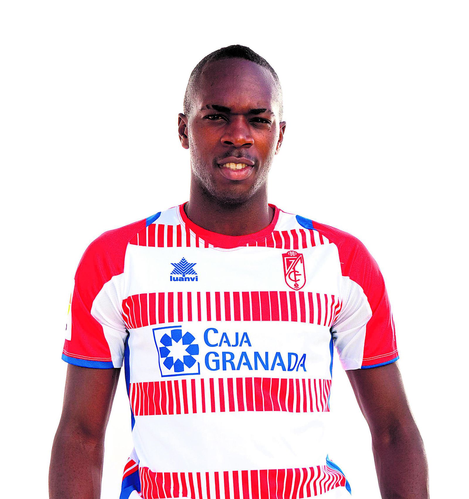 Nyom defiende a un jugador del Melilla en su primera temporada en el Granada, cuando jugaba en Segunda B.