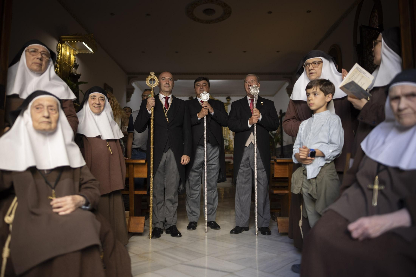 Imágenes de la salida extraordinaria de La Borriquita por las calles de Huelva