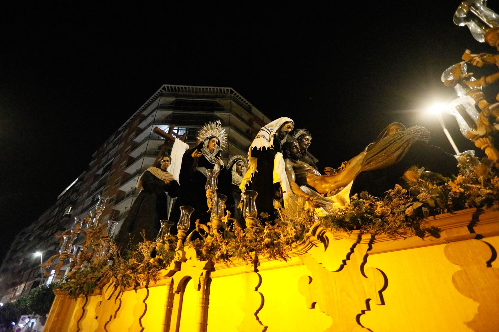 La procesión de La Caridad de Almería, en imágenes