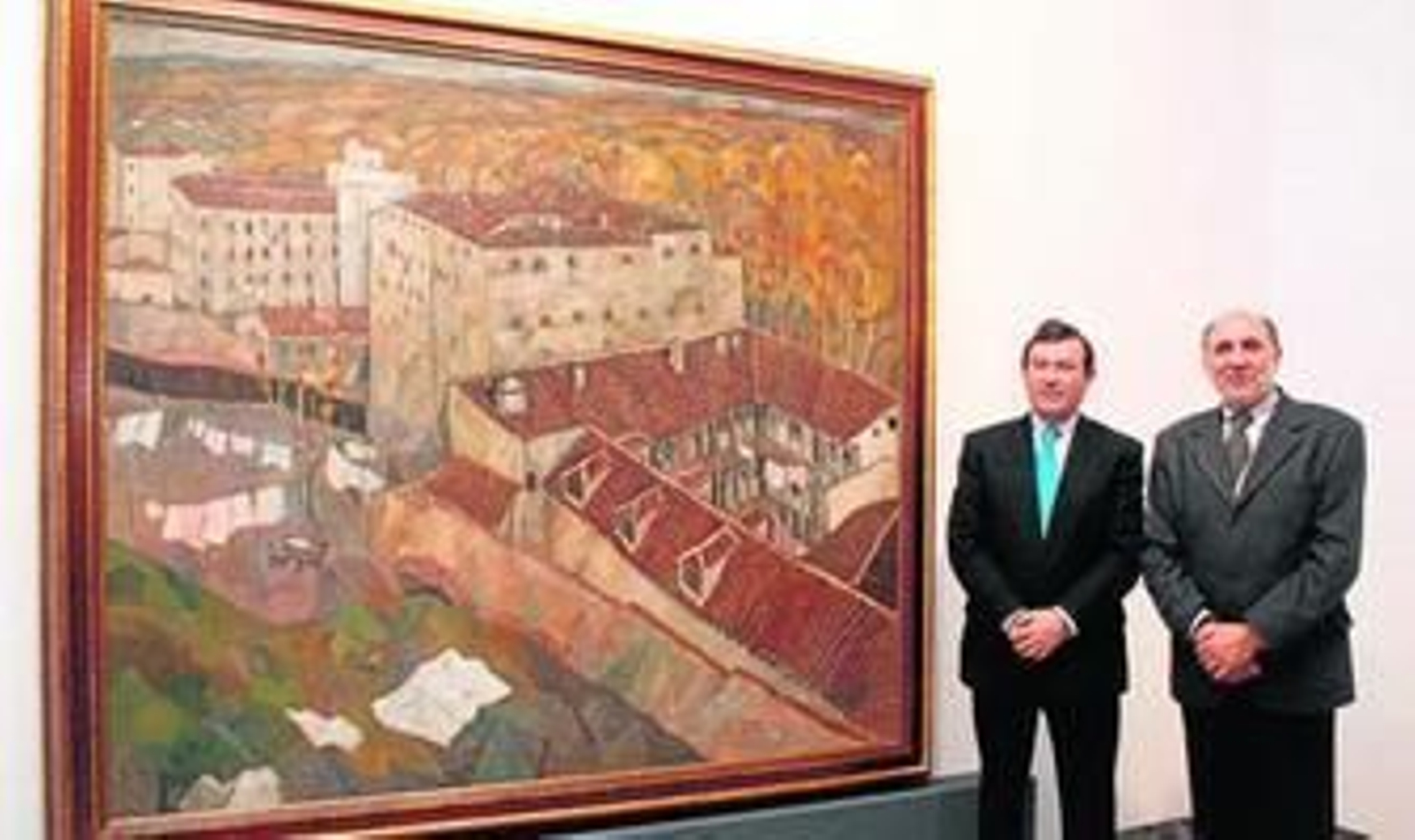 Álvaro García y Juan José Oña, junto al cuadro de José Frau 'Estampa de Madrid'.