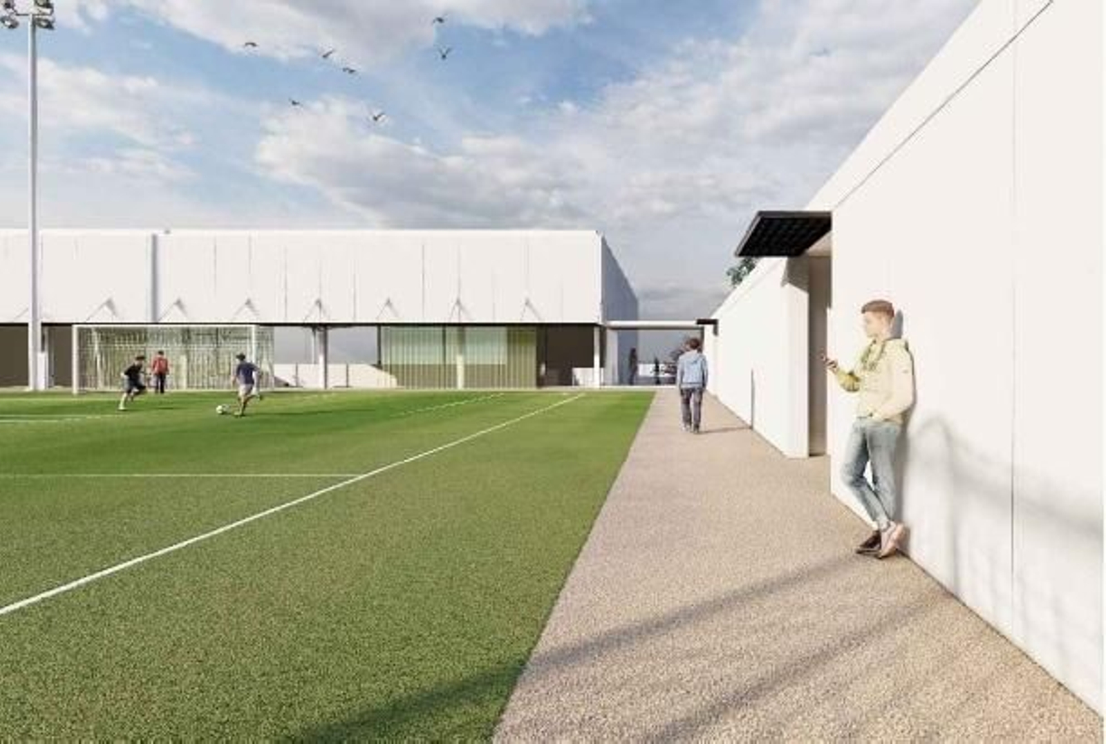 Extremo del campo de fútbol junto al acceso de Cantero Cuadrado, con el pabellón al fondo.