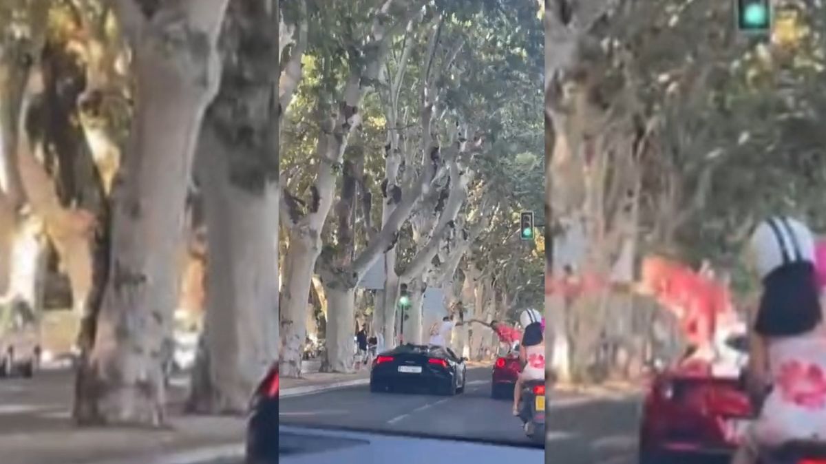 Dos deportivos cortan el tráfico en el centro de Málaga para saludarse de coche a coche en plena calzada