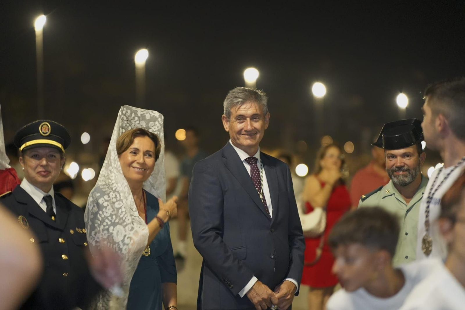 La procesión de la Virgen del Mar por las calles de Adra, en imágenes