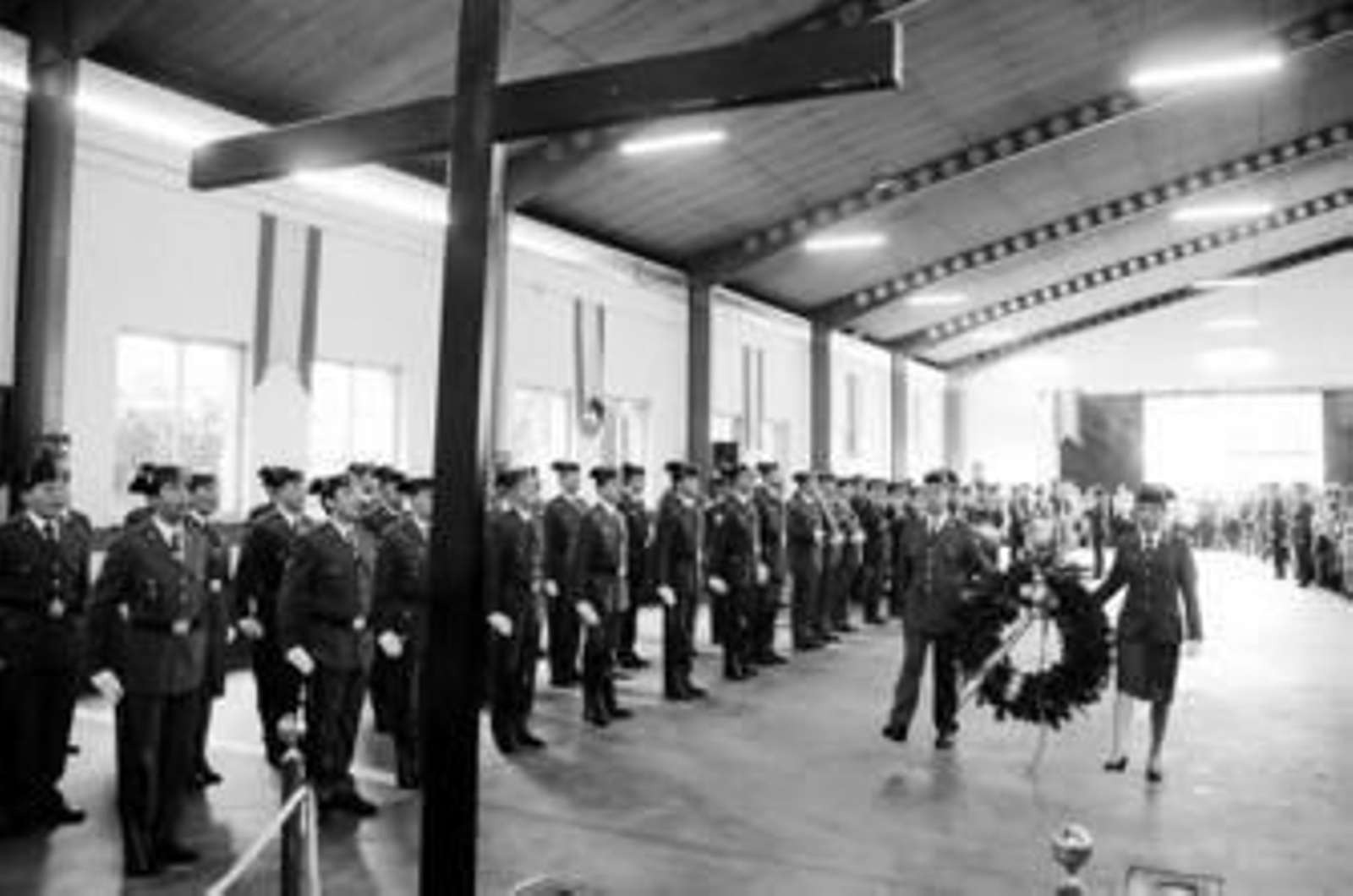 1. Un momento del homenaje a los caídos durante el acto de celebración de la Virgen del Pilar en el cuartel de Montequinto. 2. El general jefe de la IV Zona de la Guardia Civil, Antonio Dichas, impone una de las condecoraciones en presencia del delegado del Gobierno, Juan José López Garzón. 3. Uno de los agentes que recibió la cruz al mérito de la Guardia Civil con distintivo blanco posa con el perro Luca C-50, especialista en la detección de drogas. 4. Un pequeño luce el uniforme del benemérito instituto.