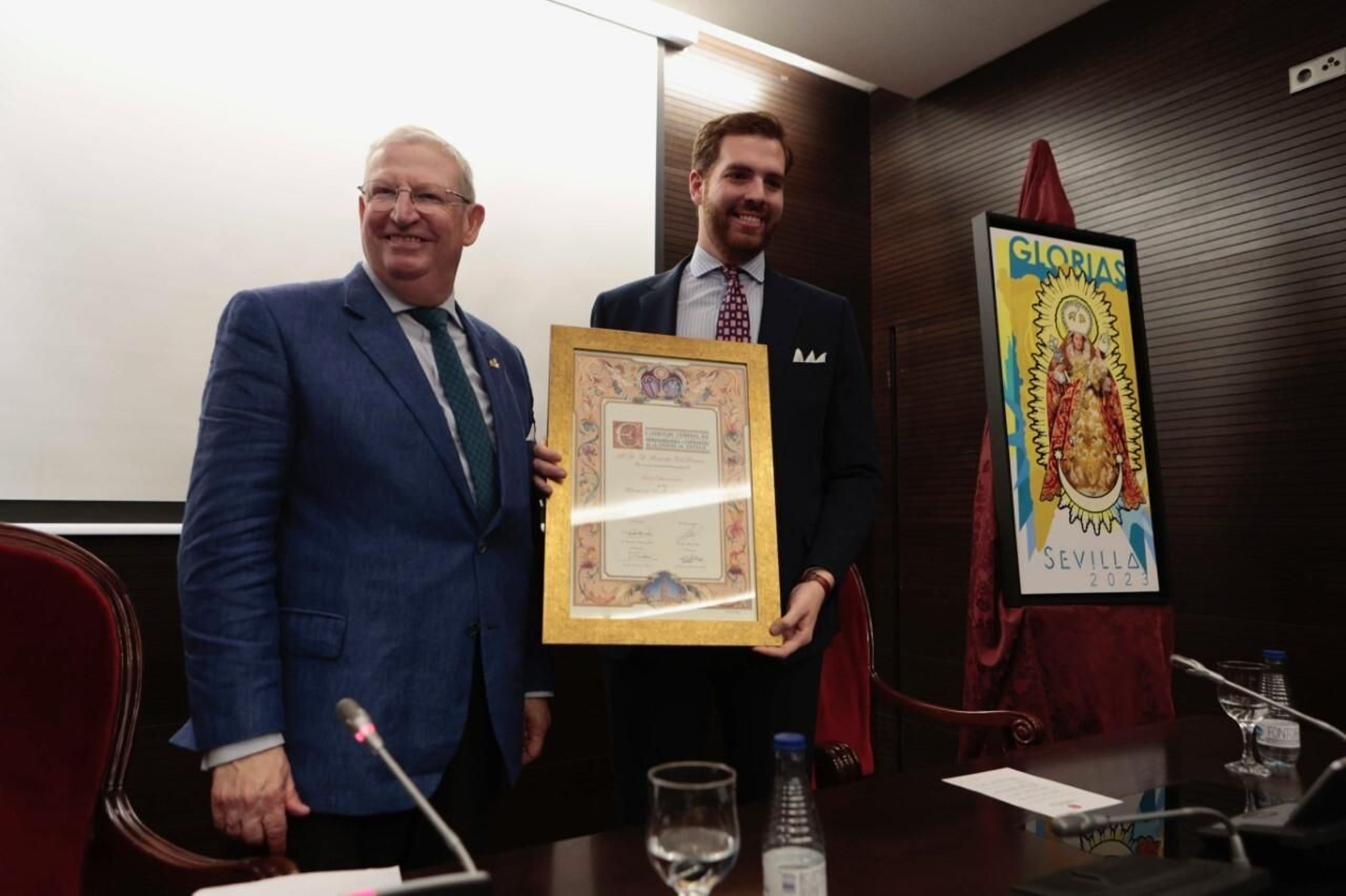 El presidente del Consejo y el autor del cartel.