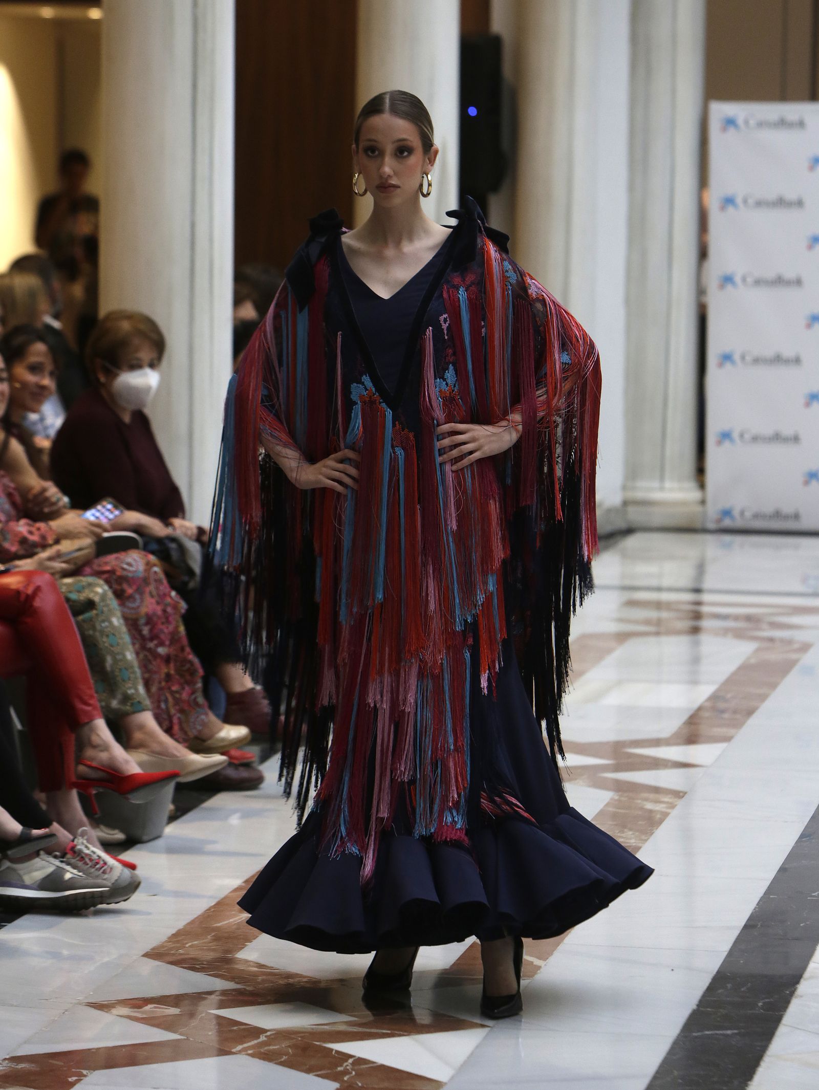 Desfile moda flamenca en las vísperas de la Feria de Abril CaixaBank