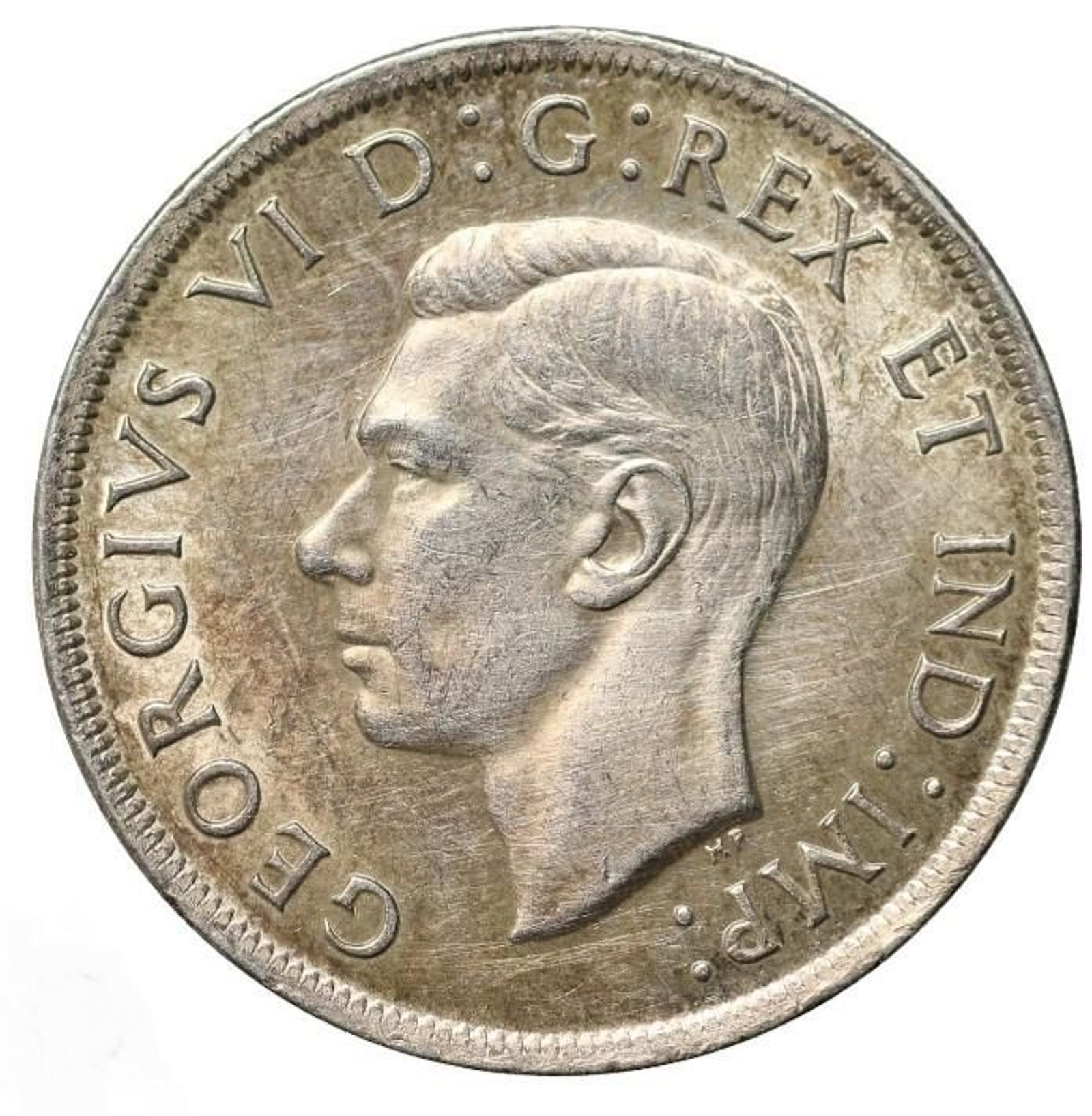 Una moneda con la efigie de Jorge VI