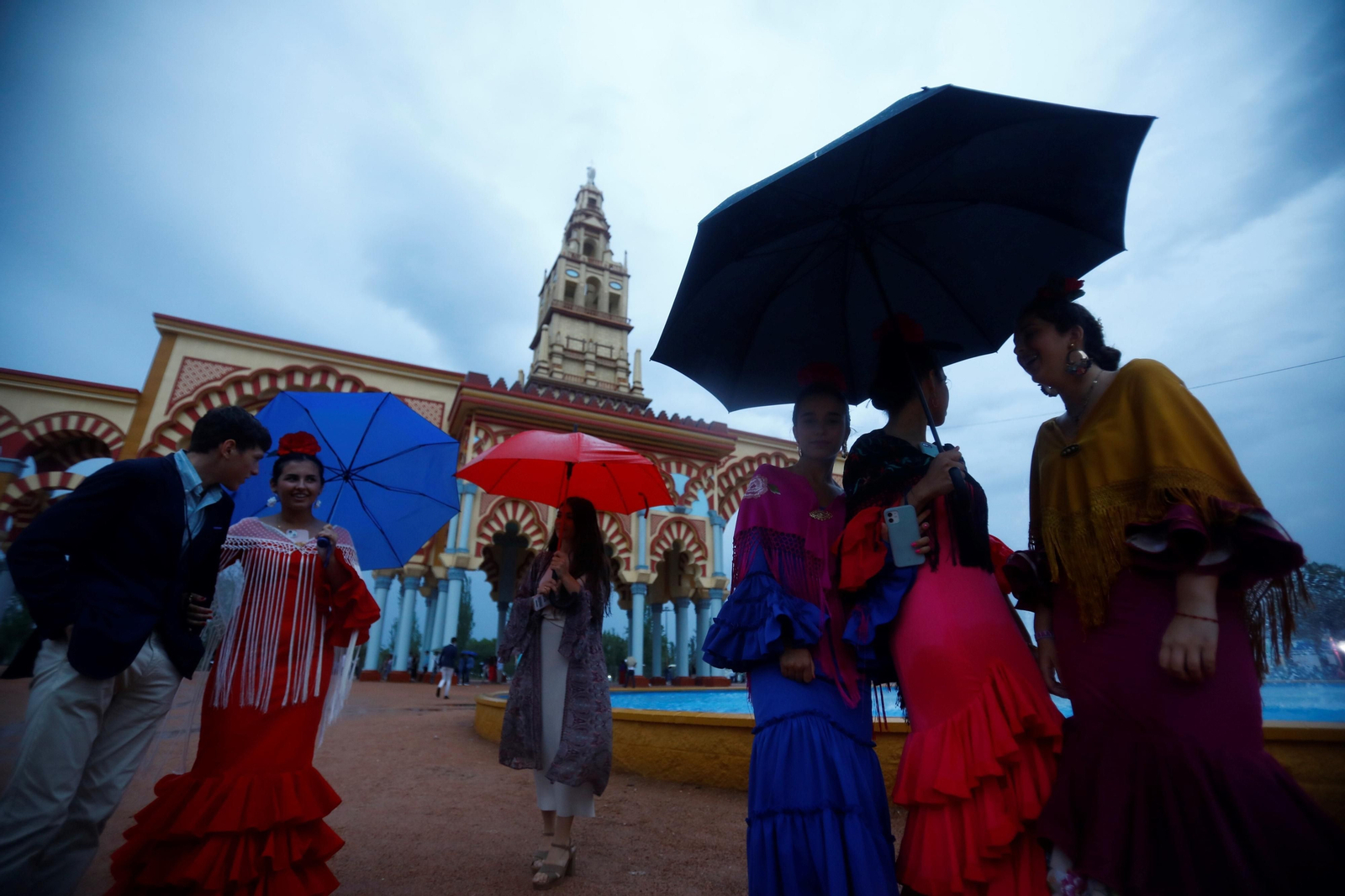 La intensa lluvia de este sábado en la Feria de Córdoba, en imágenes