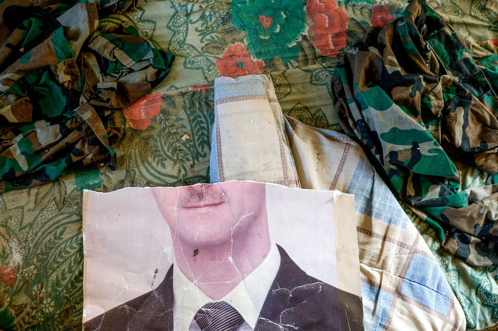 Un retrato roto de Bashar al-Assad en Damasco.