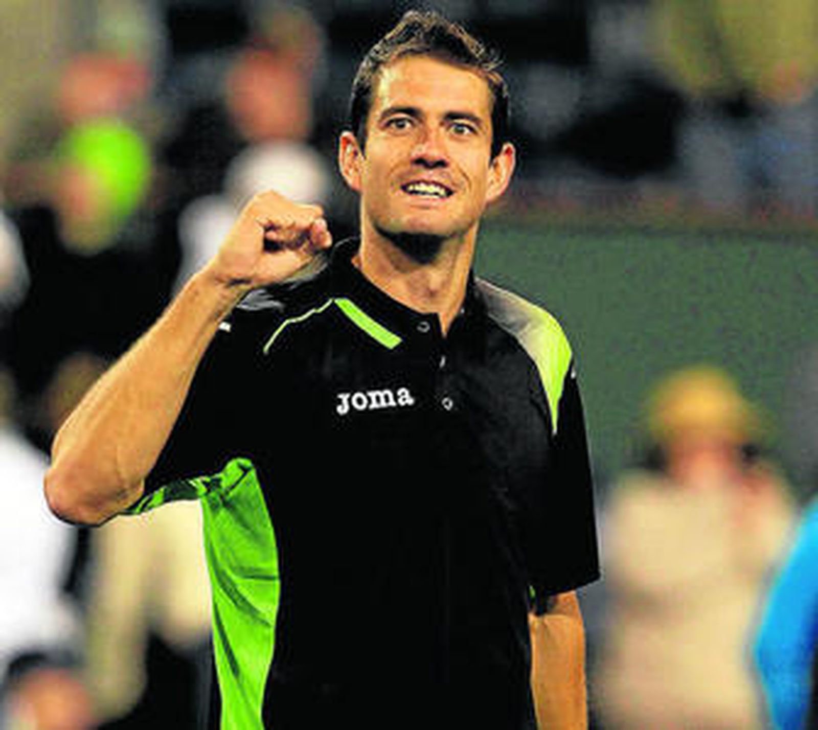 García López celebra su triunfo sobre Murray.