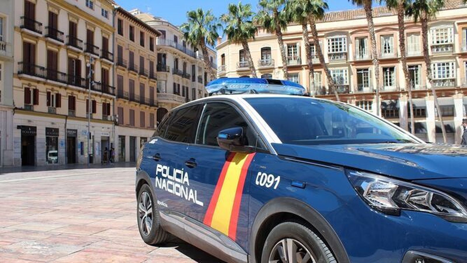 Un vehículo de la Policía Nacional en Málaga.