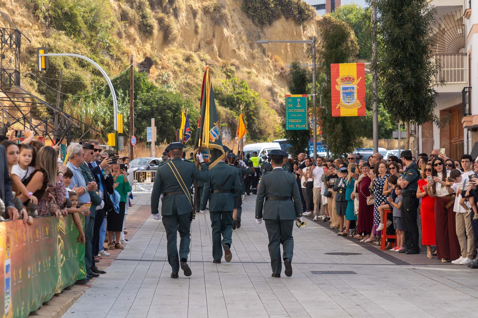 Imágenes del desfile de la Guardia Civil en el Día de la Hispanidad y de su patrona en la Plaza de La Merced