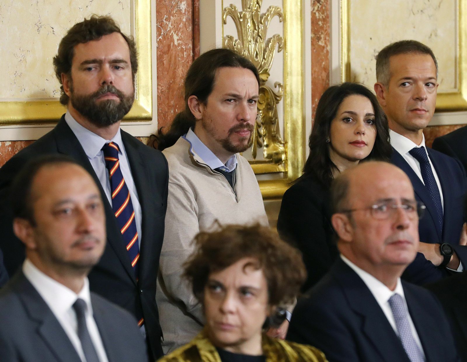Pablo Iglesias, entre el diputado de Vox Iván Espinosa de los Monteros e Inés Arrimadas, de Cs, este viernes en el Congreso.
